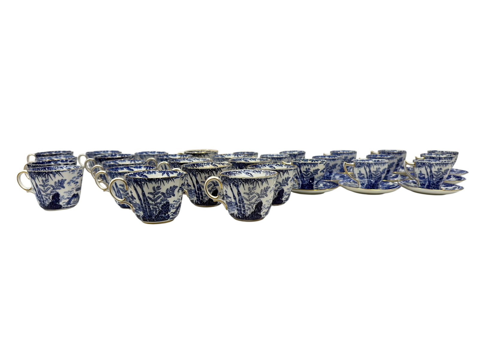 Royal Crown Derby 42-Piece Blue Mikado Bone China Teacup and Saucer Collection: An extensive assembled collection of 42 Royal Crown Derby English bone china pieces in the celebrated Blue Mikado pattern, comprising approximately 30 teacups and 12 saucers. Decorated in deep cobalt 