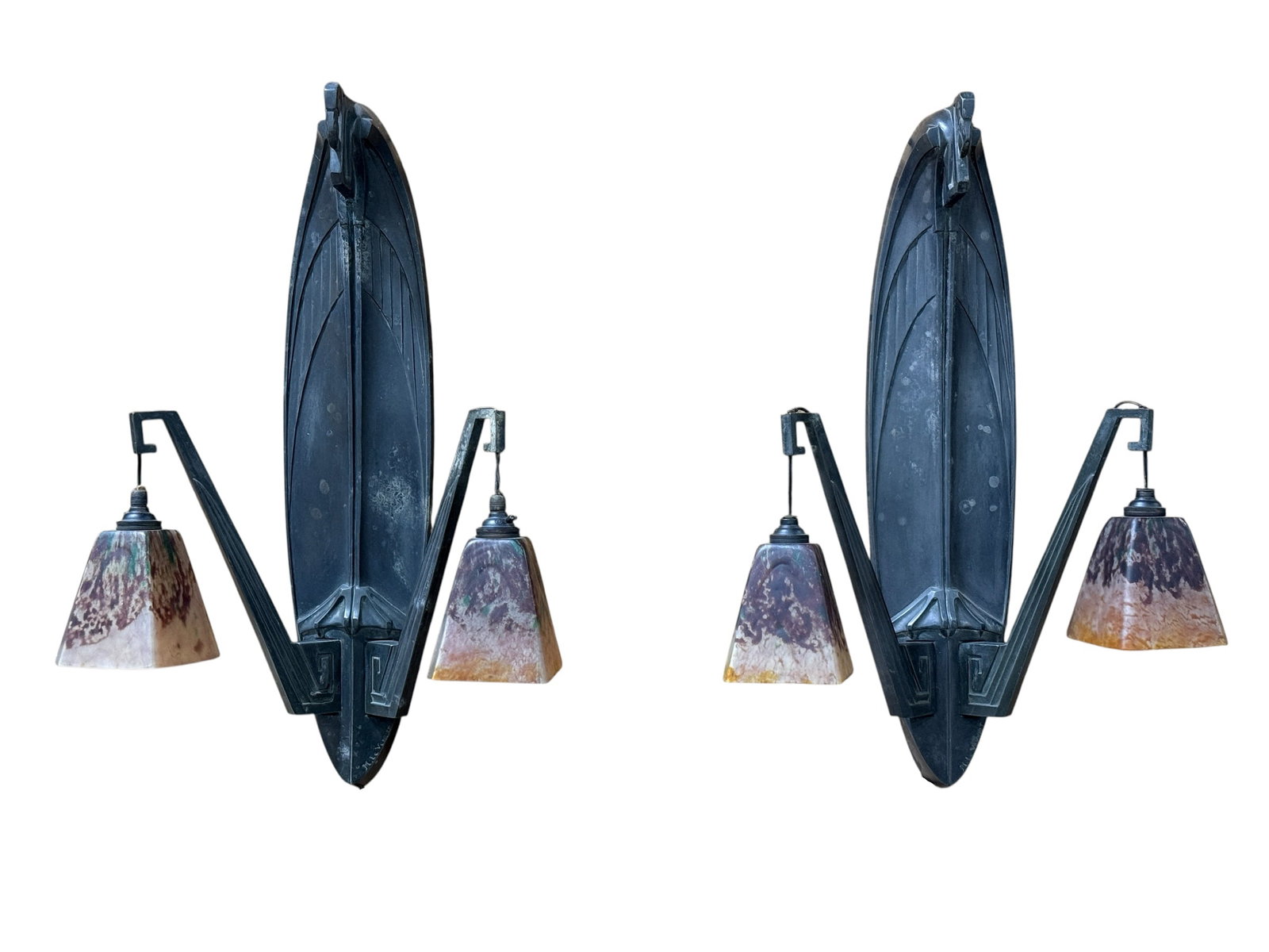 Max Le Verrier & Daum Nancy, Pair of French Art Deco Two-Light Wall Sconces, c. 1930: Pair of French Art Deco wall sconces by Max Le Verrier, each sculptural dark-patinated metal backplate modeled as a dramatically elongated stylized bird with streamlined geometric plumage and angular 