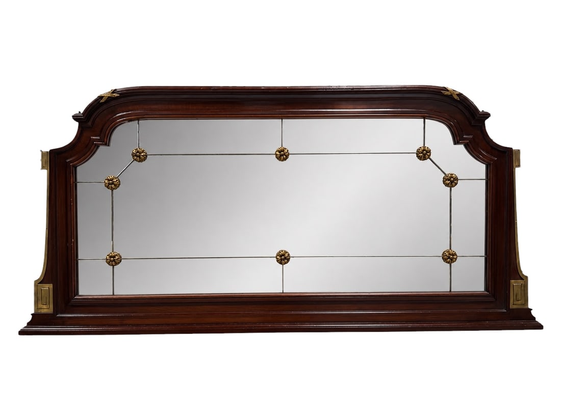Late 19th / Early 20th Century Mahogany and Brass Mounted Overmantel Mirror: Large mahogany overmantel mirror of architectural form, likely dating to the late 19th or early 20th century, the richly figured wood frame shaped with a broad stepped and arched crest above a wide re