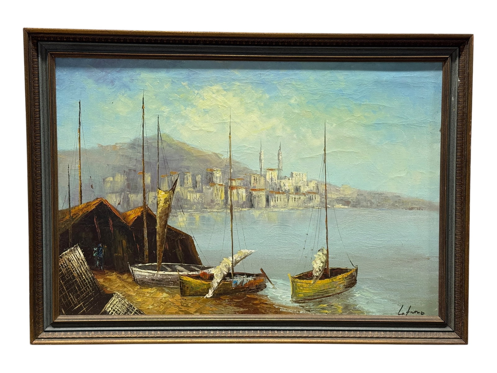 Signed Oil on Canvas Sailboats & Mediterranean Coastal Cityscape Painting: An atmospheric oil on canvas harbor scene depicting several moored sailboats resting along a working waterfront, their tall masts rising against a softly illuminated sky with a distant Mediterranean-s