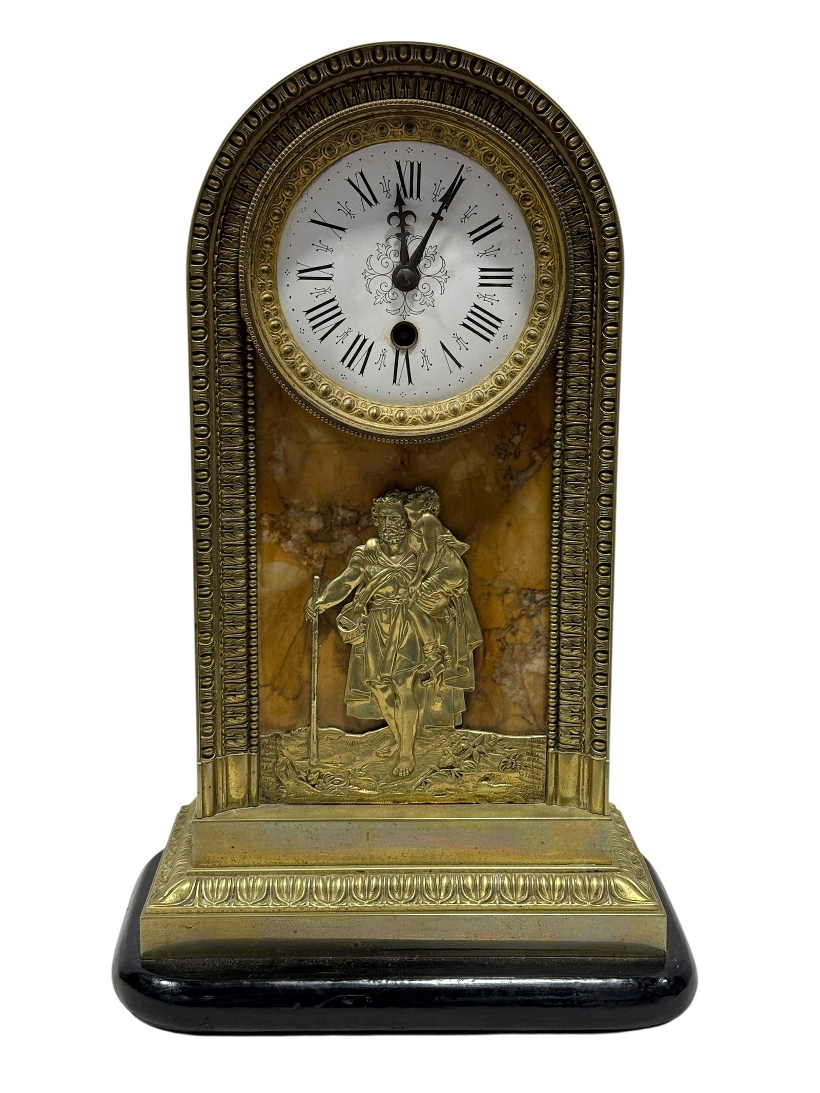 French Empire-Style Siena Marble and Gilt Brass Figural Mantel Clock, 19th Century: French Empire-style architectural mantel clock, likely 19th century, constructed with a warm golden Siena marble front panel enclosed within an arched brass case richly ornamented with repeating class
