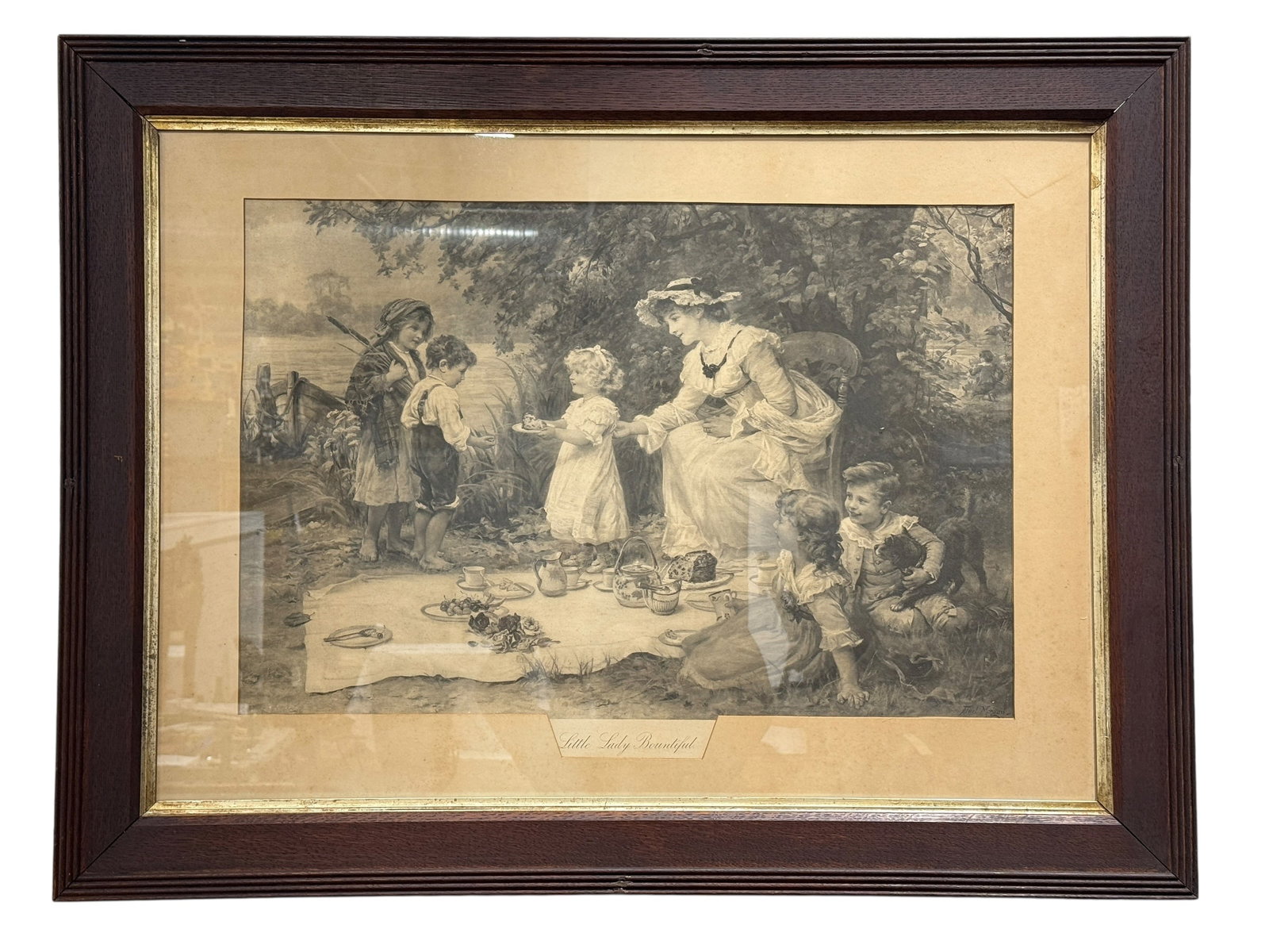 Circa 1900 Large Framed “Little Lady Bountiful" Print After Frederick Morgan: Large early 20th-century black-and-white print after British genre painter Frederick Morgan, titled Little Lady Bountiful, depicting an idyllic outdoor picnic scene in which a finely dressed mother an