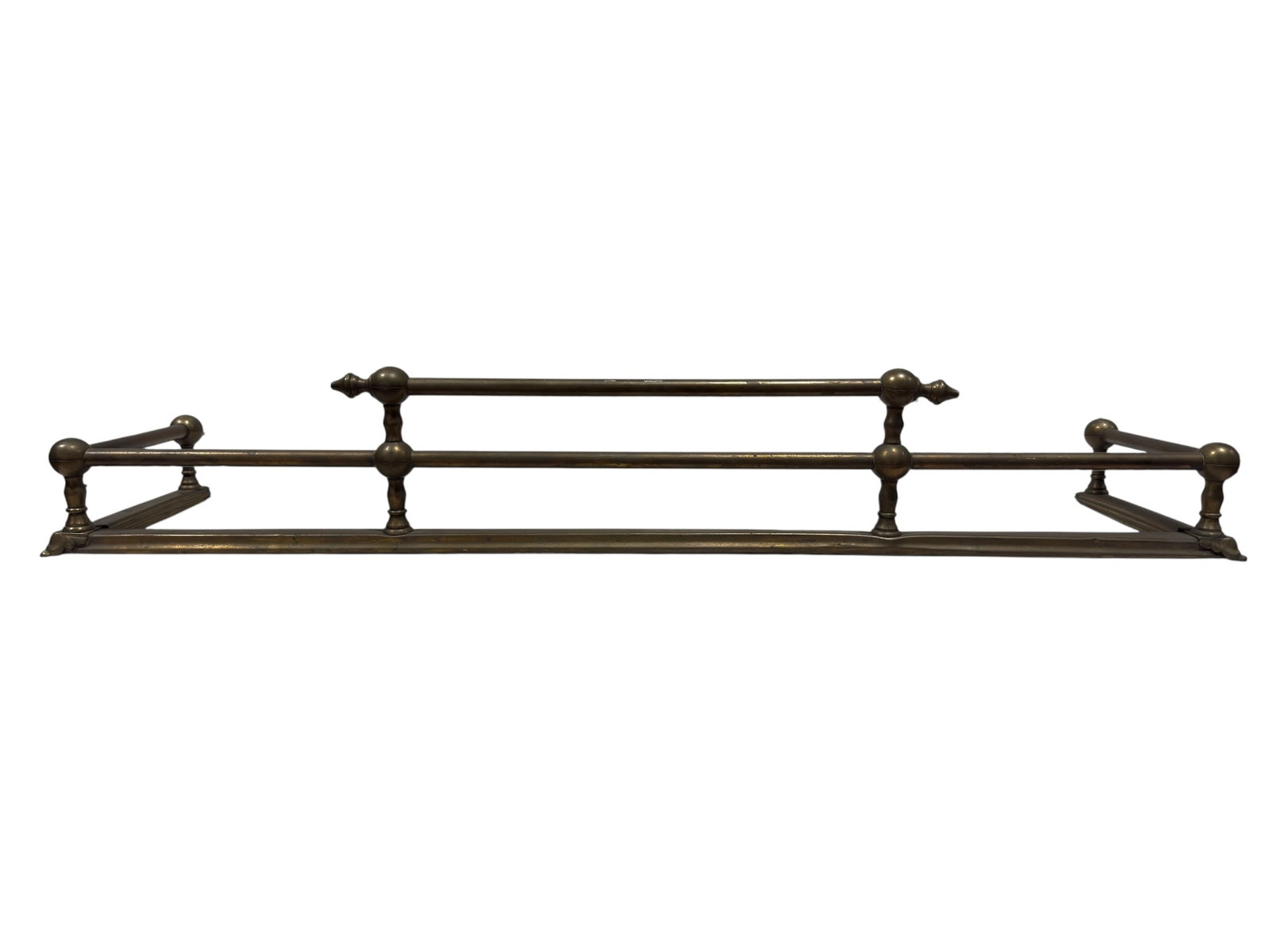 Vintage Double-Rail Brass Fireplace Fender, Neoclassical Style: Long decorative brass fireplace fender of Neoclassical and Federal Revival inspiration, constructed with a molded rectangular base supporting two parallel tubular gallery rails joined by regularly spa