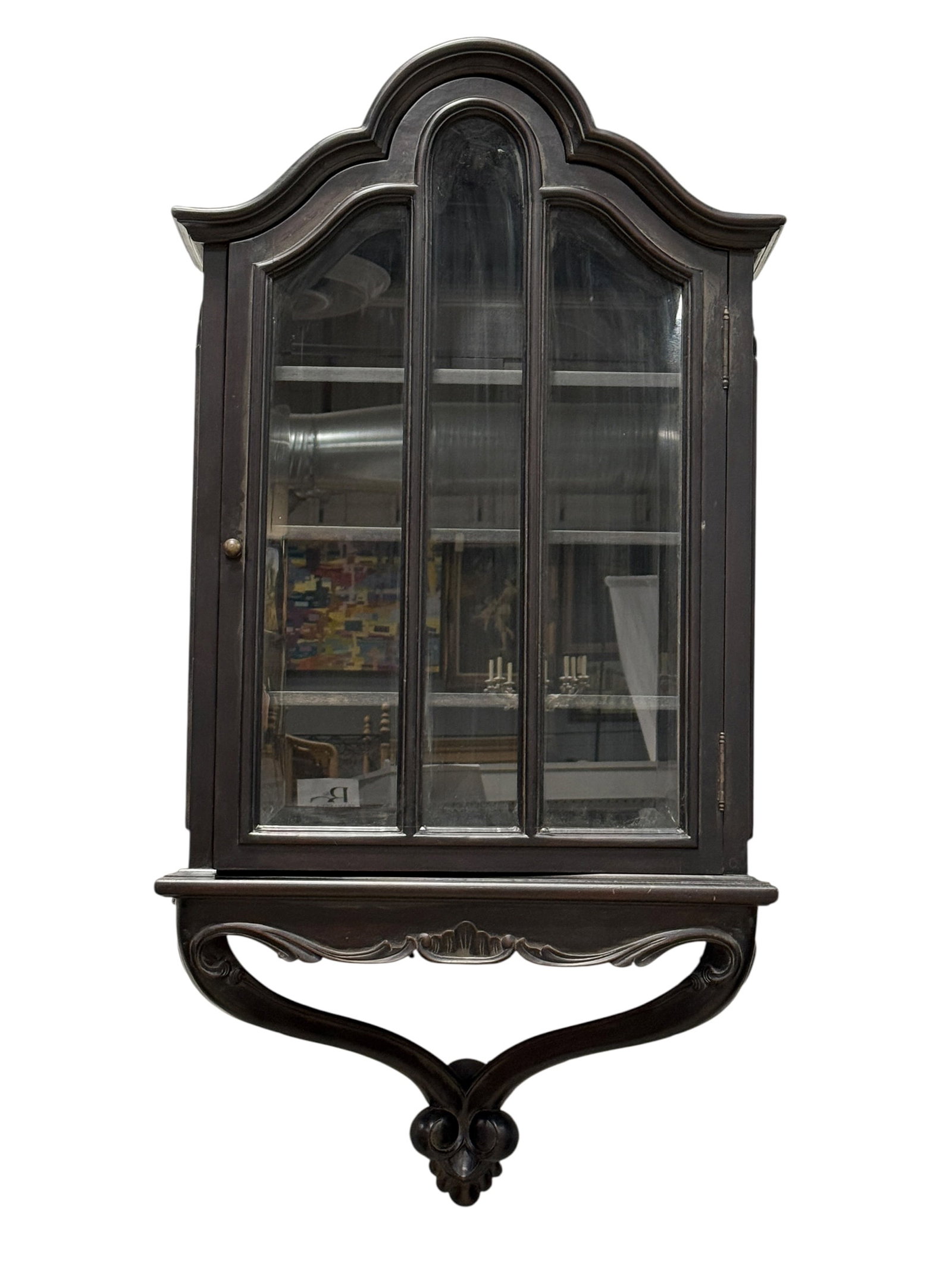 Vintage Carved Wood Wall-Mounted Curio Display Cabinet: Vintage wall-mounted curio or display cabinet in a deep espresso-brown finish, featuring a highly decorative shaped crest with sweeping serpentine moldings and a prominent raised central arch that