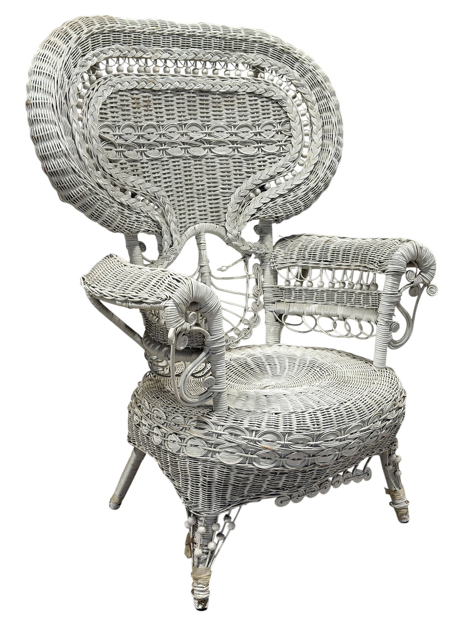 Vintage Painted Wicker Peacock Chair: Large vintage painted wicker peacock chair, likely mid-20th century, designed with an exuberant high fan-shaped back rising dramatically above a broad circular woven seat and scrolling arm supports.