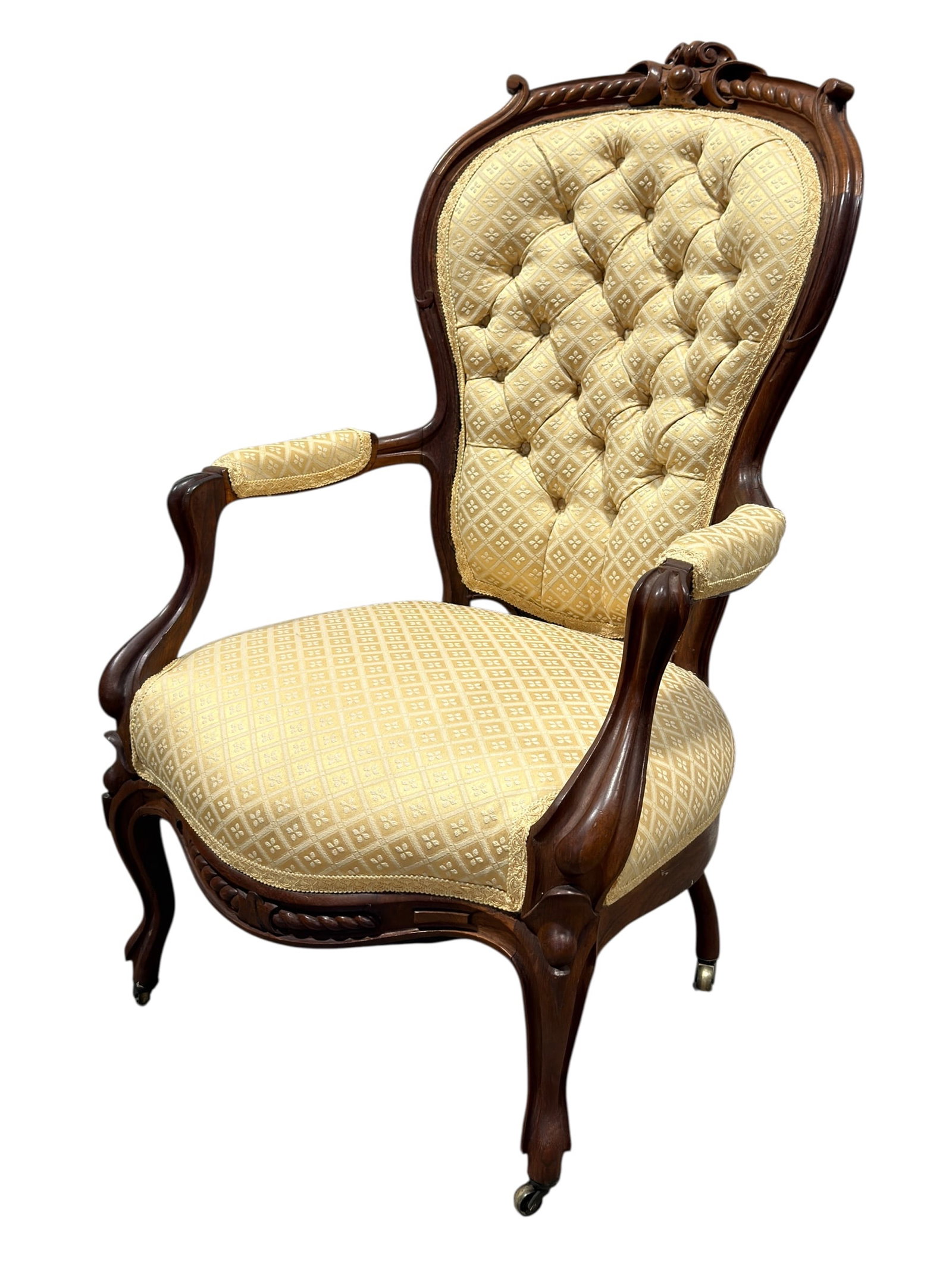 Victorian Carved Walnut Gentleman’s Armchair w/ Tufted Upholstery: Large 19th-century Victorian carved walnut gentleman’s armchair, designed with a broad shield- or balloon-form upholstered back framed by substantial molded walnut and surmounted by a richly carved 