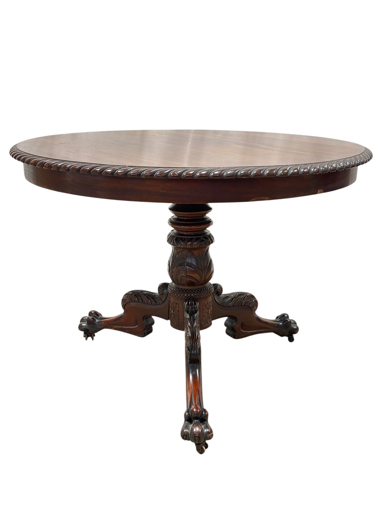 Victorian Carved Mahogany Round Pedestal Center Table with Rope-Twist Edge, Late 19th Century: Substantial late 19th-century Victorian carved mahogany center or dining table featuring a broad circular top edged with pronounced rope-twist molding above a deep plain apron. The table is supported 