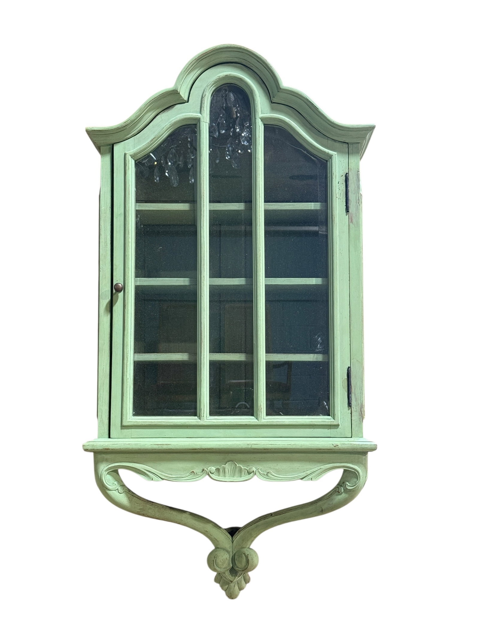 Vintage French Provincial Style Wall Curio Cabinet: Charming vintage French Provincial-style wall-mounted display cabinet or vitrine, crafted in wood and finished in a soft celadon or pale mint-green painted surface with gently distressed character. Th