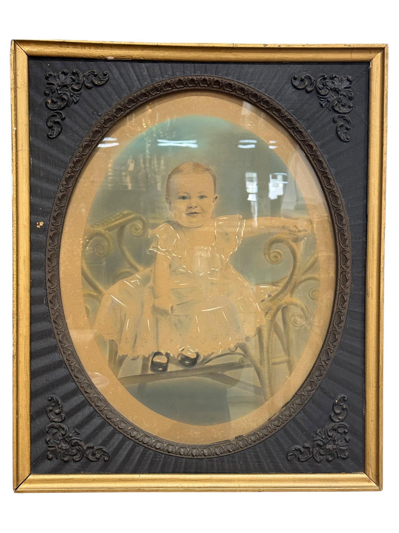 Antique Late Victorian Child Portrait: Charming antique late 19th- to early 20th-century portrait of a young child seated in an upholstered armchair, rendered as a photographic enlargement with extensive hand coloring and artist-applied