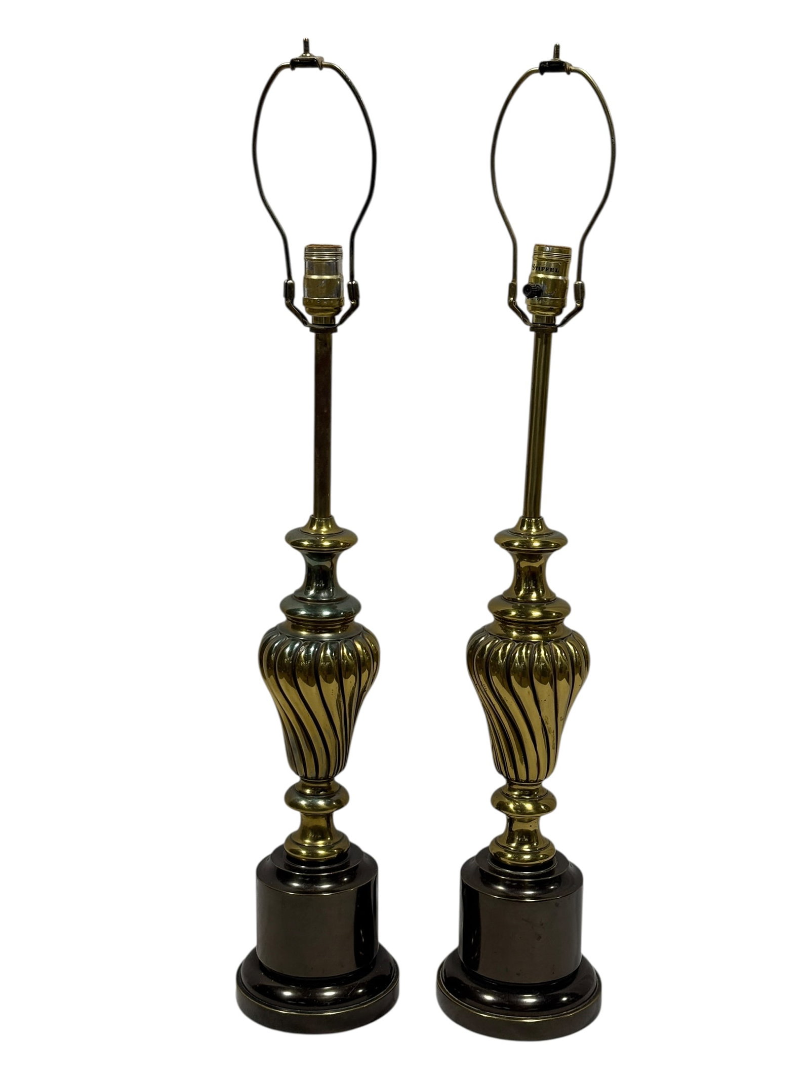 Pair of Vintage Stiffel Brass Urn Form Table Lamps: Pair of vintage Stiffel table lamps in a stately urn-form design, each featuring a tall slender brass standard rising above a deeply fluted baluster-form body with layered collar moldings and a contra