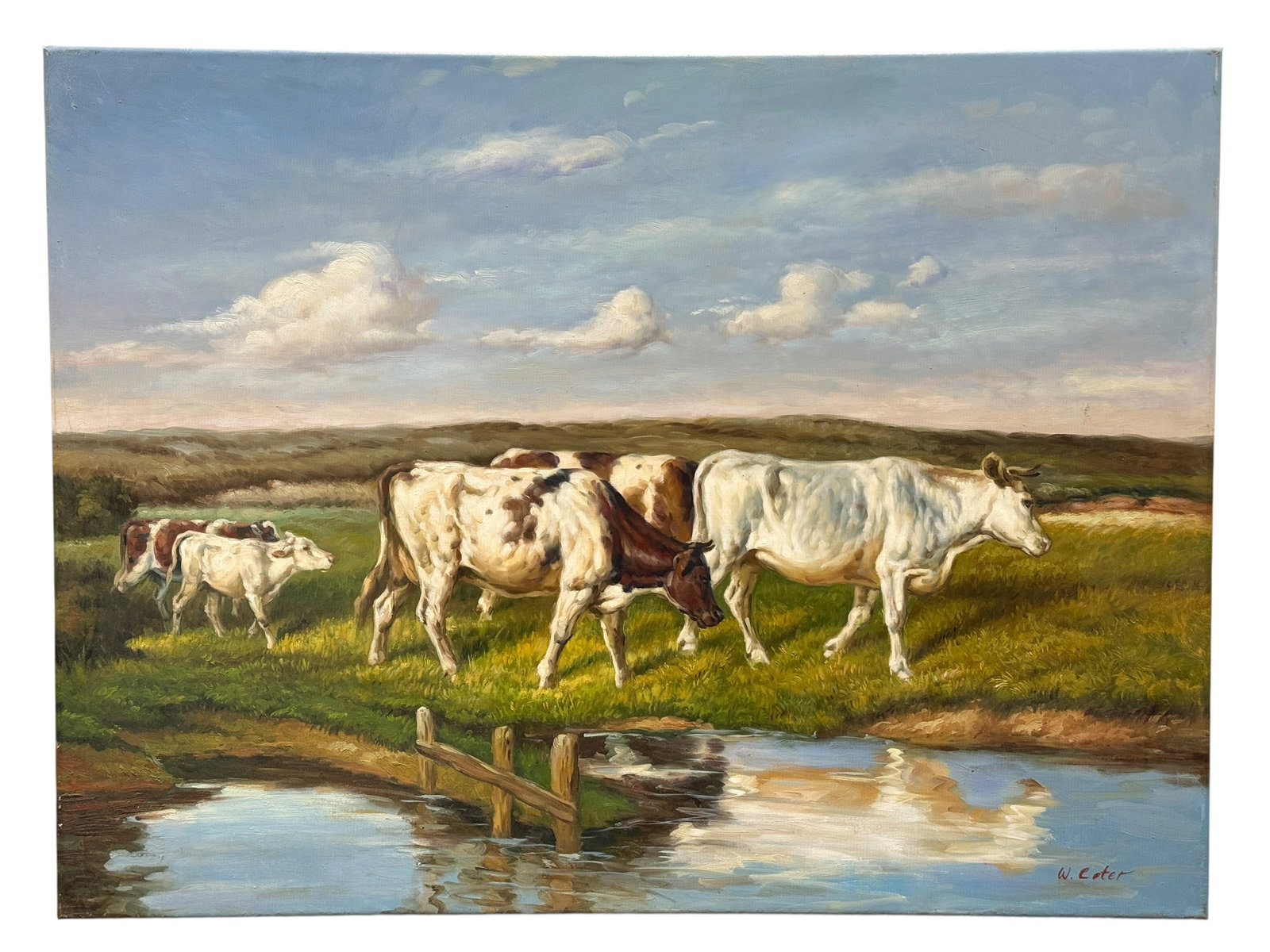 Signed W. Voter Cattle by a Pond Oil on Canvas: This oil on canvas pastoral landscape depicts a small herd of cattle moving through a sunlit meadow beside a reflective pond by W. Voter, with a rustic fence crossing the foreground and broad rolling 