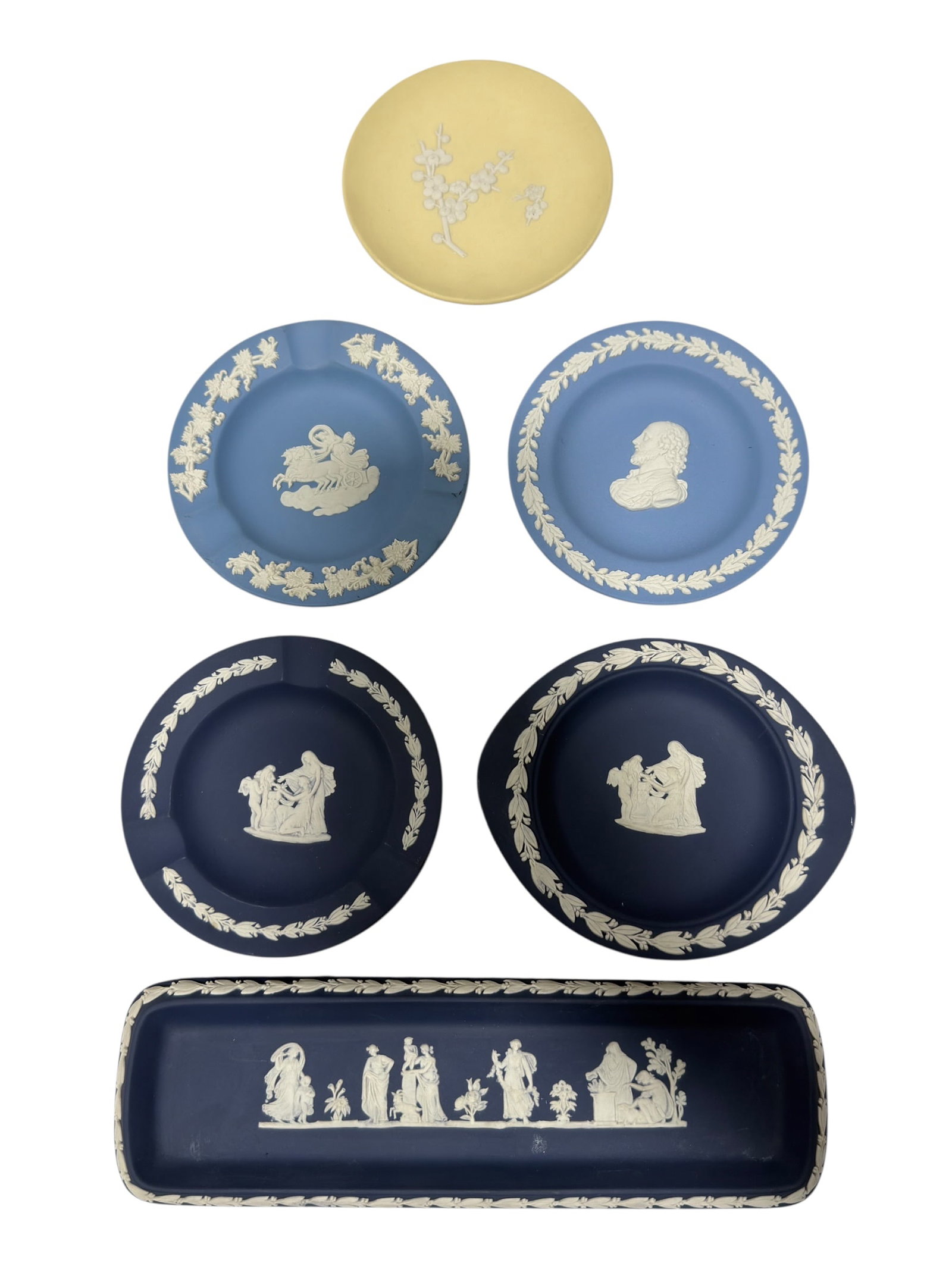(6) Wedgwood Jasperware Assortment: Group of six Wedgwood jasperware pieces, with all examples marked Wedgwood, comprising an assortment of round dishes/plates and one rectangular tray in varying shades of blue and yellow. Each is decor