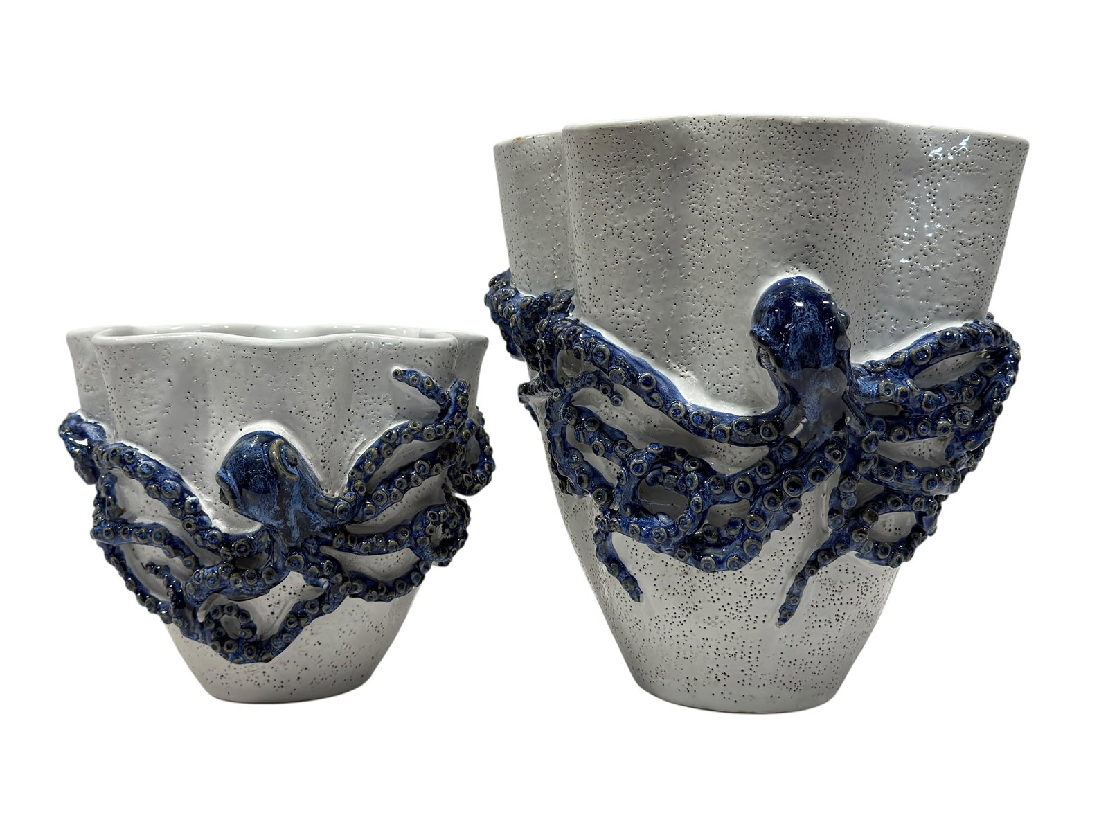 Pair of Contemporary Blue & White Sculptural Ceramic Octopus Vases: Striking pair of contemporary sculptural ceramic vases designed with dramatic three-dimensional octopus decoration, each combining a softly textured white ground with richly glazed cobalt and navy