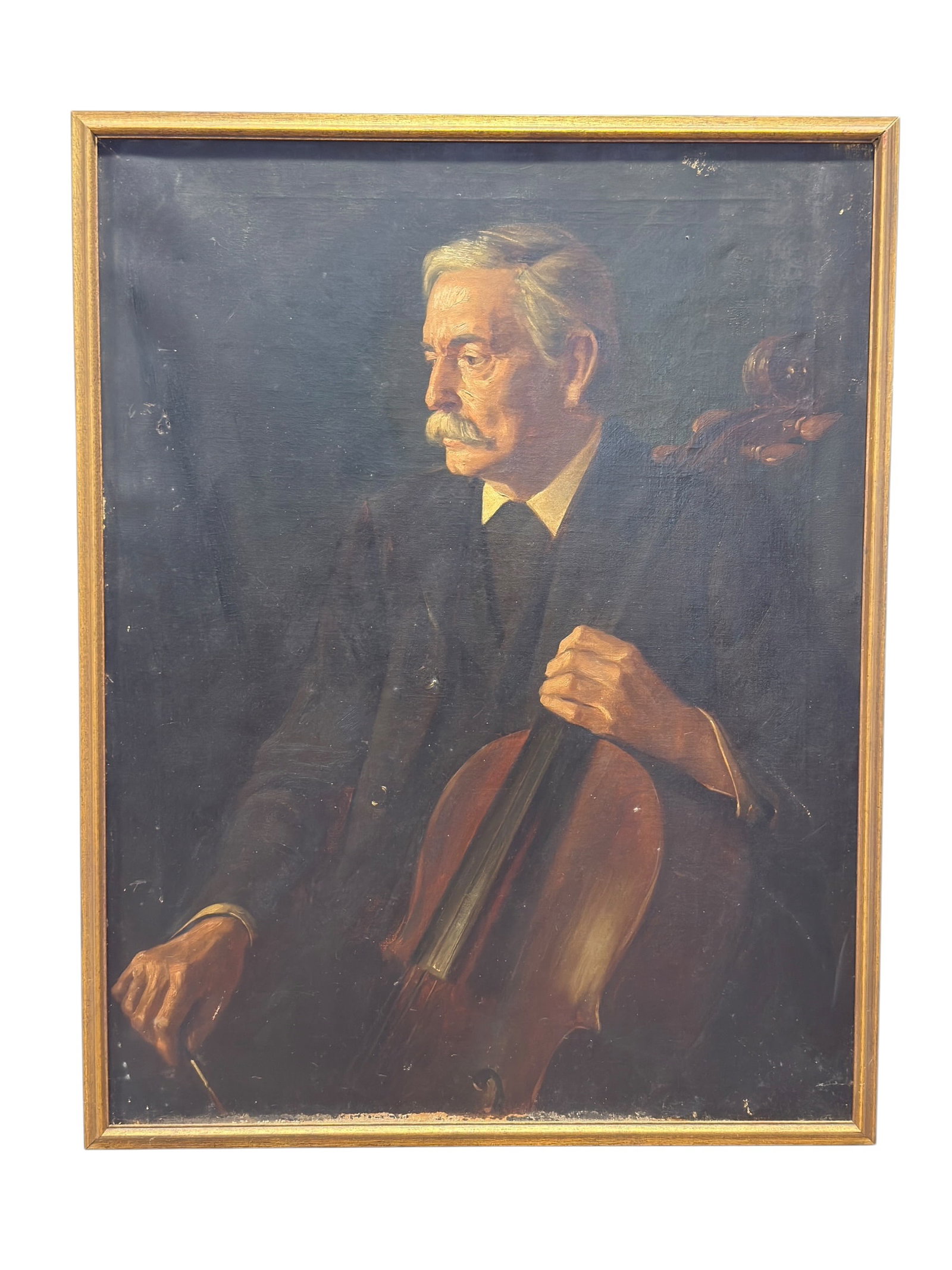 Early 20th Century Oil on Canvas Portrait of a Cellist: Early 20th century oil on canvas portrait depicting a distinguished seated male musician posed with a cello, rendered in a restrained, academic manner with warm amber highlights emerging against a dee