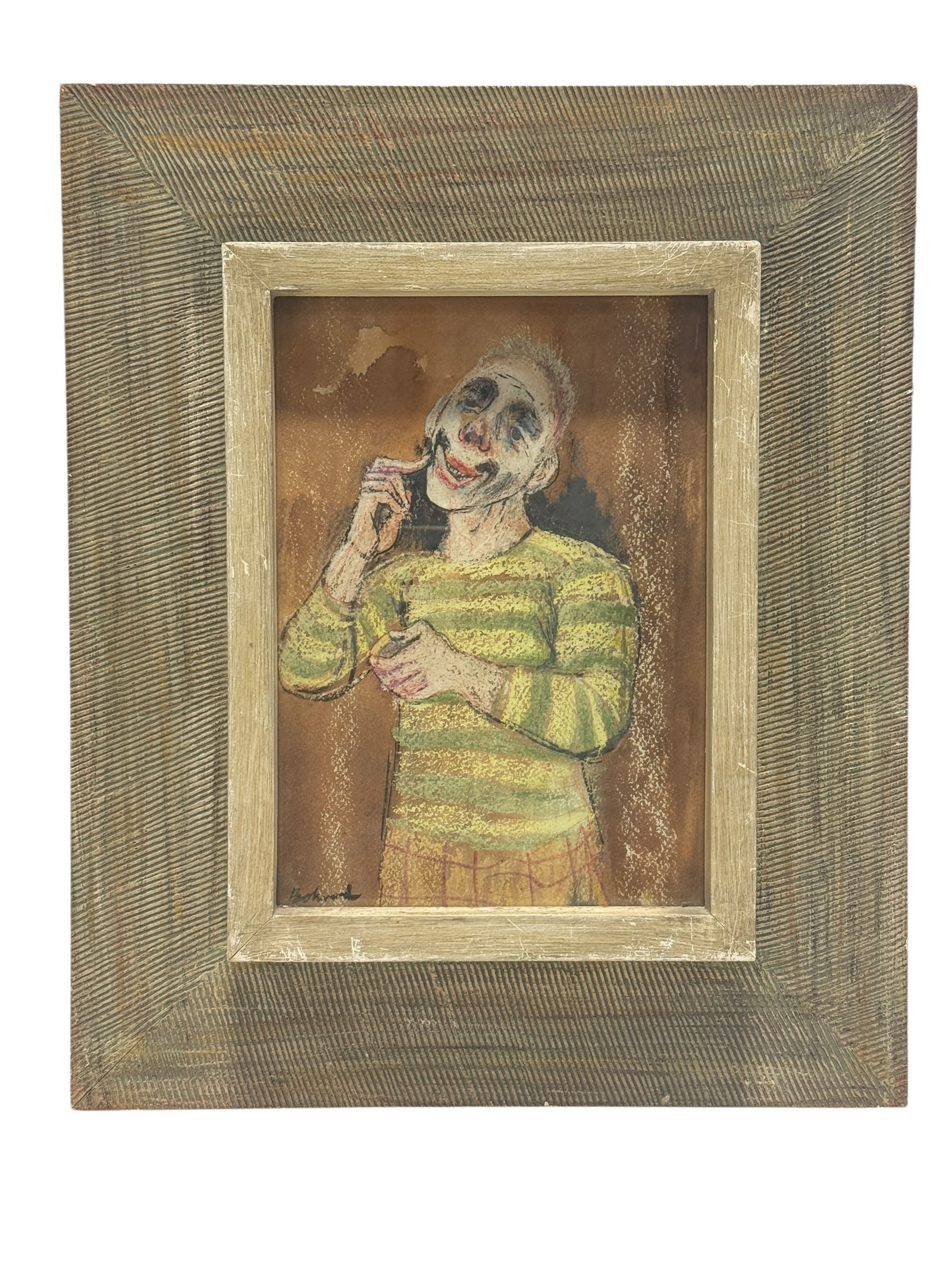 Signed Aaron Bohrod American Pastel Clown Portrait: A striking and psychologically expressive clown portrait rendered in pastel and mixed drawing media, capturing a smiling performer in a green-and-yellow striped shirt and patterned trousers as he