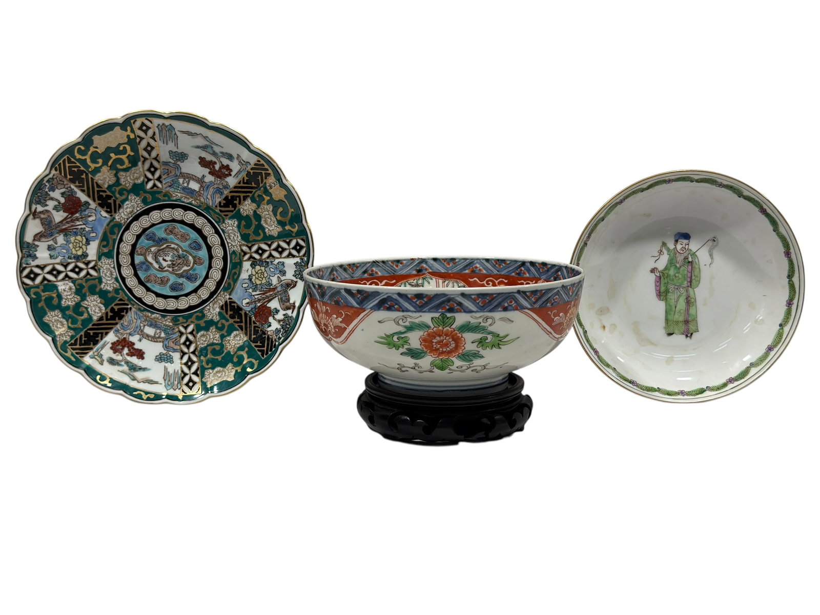 1 Japanese Porcelain Bowl & 2 Decorative Plates, 20th Century: A decorative group of three Japanese porcelain tablewares comprising one shallow bowl and two plates, each displaying a distinct interpretation of traditional Asian motifs. The bowl is centered by a