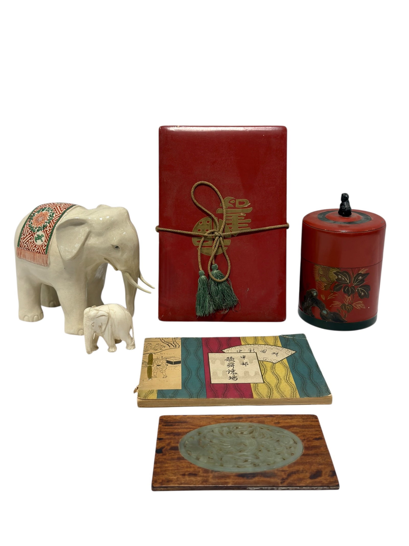 Assorted Asian Decorative Arts Group, 6Pcs: Eclectic group of Asian decorative and collectible items including a large glazed ceramic elephant decorated with a colorful patterned saddle cloth, a smaller carved bone elephant figure, a red and