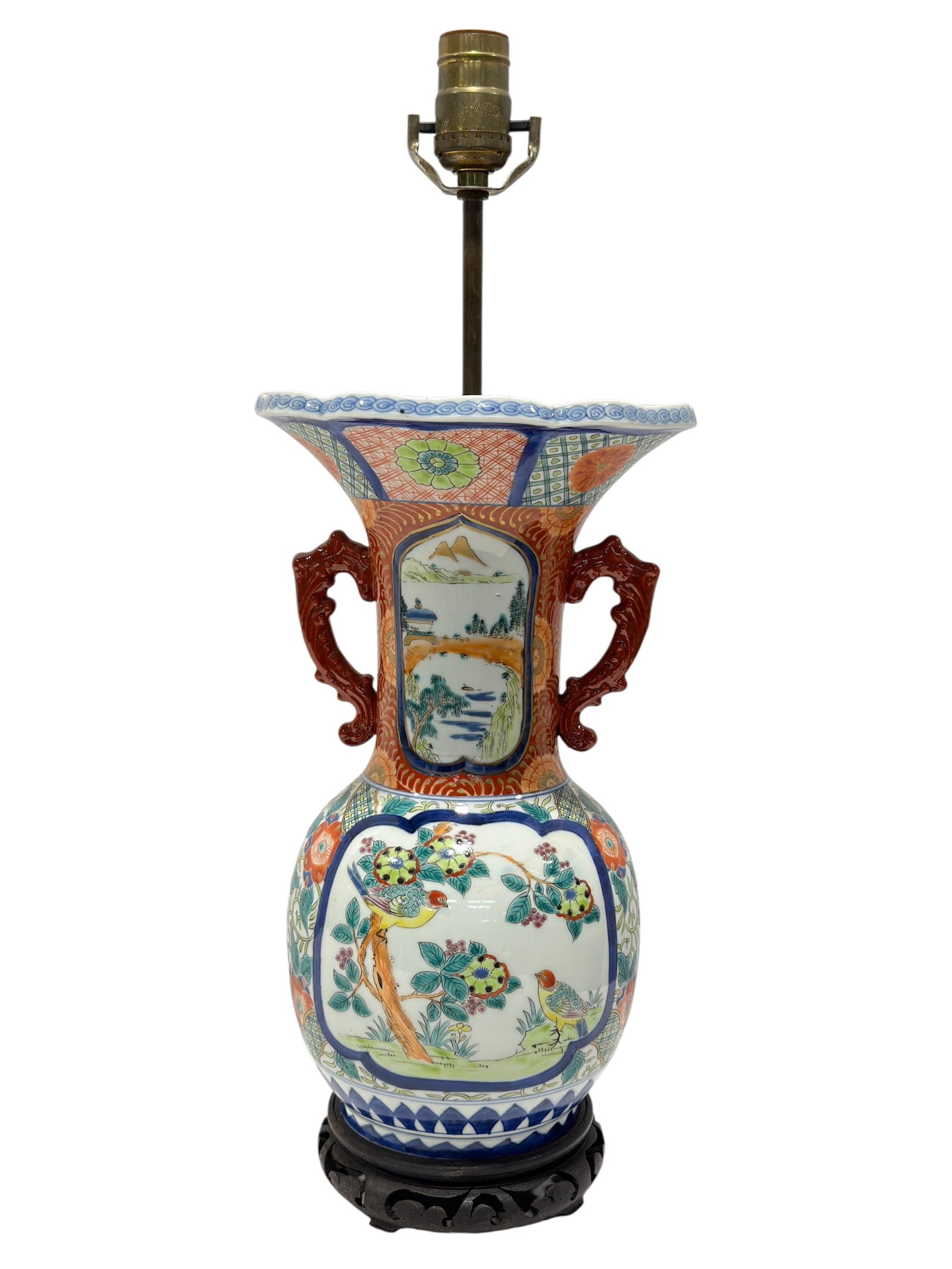 Asian Famille Rose Porcelain Vase Table Lamp: Decorative Asian porcelain vase converted into a table lamp, featuring a bulbous body, tall flared neck, scalloped rim, and applied scrolling handles in a deep iron-red glaze. The porcelain is richly 