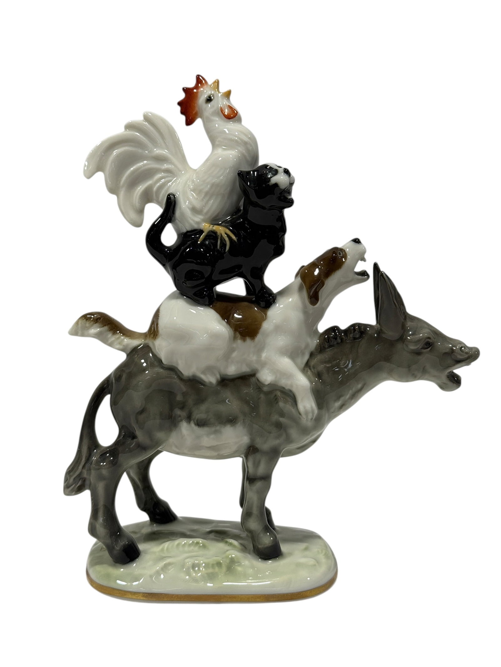 Lorenz Hutschenreuther Kunstabteilung "Town Musicians of Bremen" Porcelain Figurine: A lively and highly decorative German porcelain figural group depicting the famous Town Musicians of Bremen, with the four animals stacked one atop another in the classic composition: a gray donkey