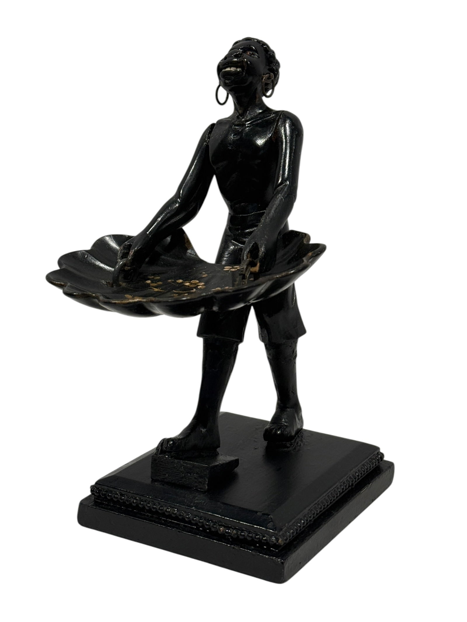 Late 19th Century Venetian-Style Carved Moorish Figural Calling Card Receiver: Striking late 19th century Venetian-style figural calling card receiver, carved and finished in black with a standing attendant supporting a broad scalloped tray suspended from metal rings at the hand