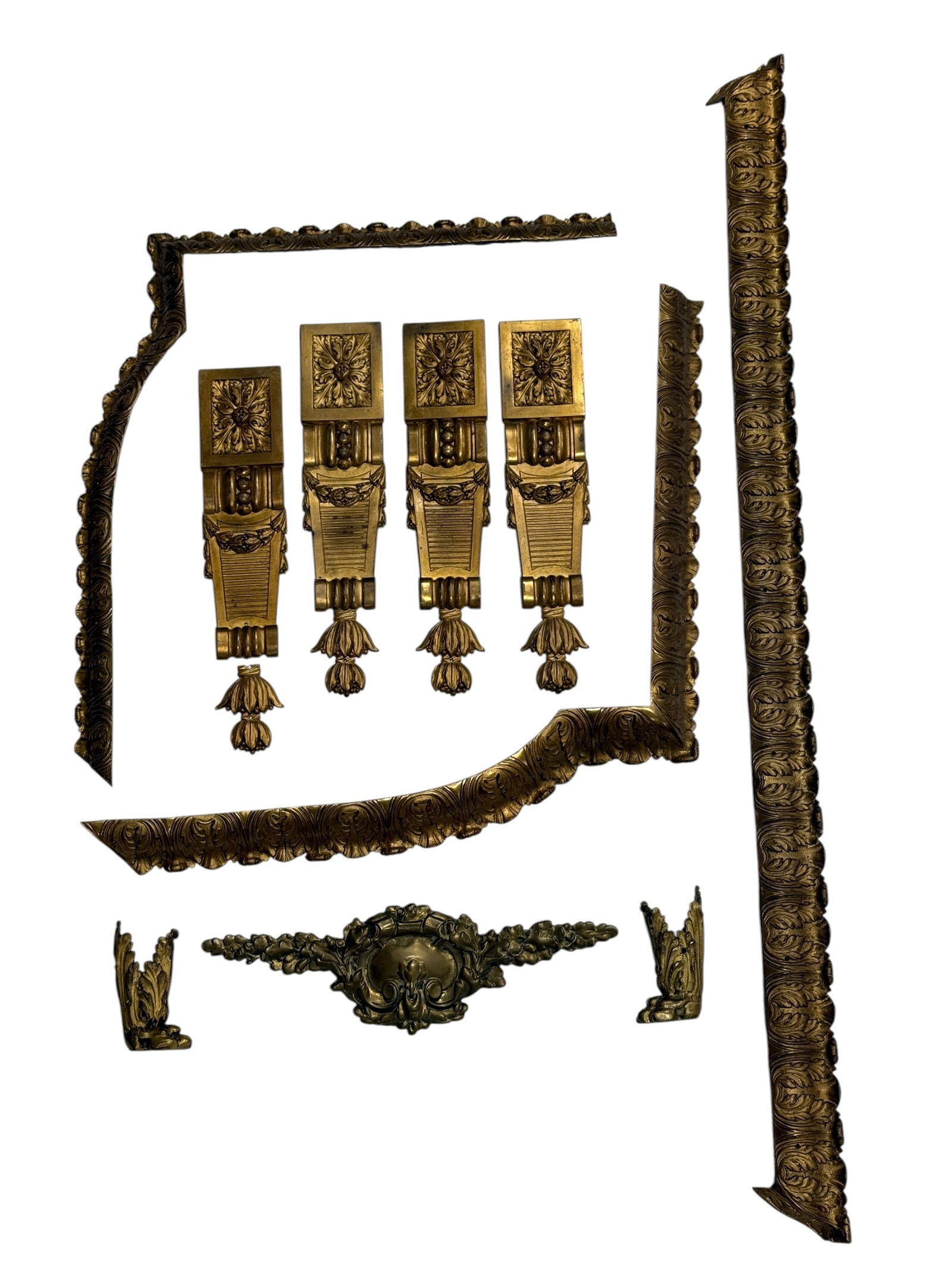 Group of Antique Gilt Bronze Ormolu Furniture & Architectural Mounts: Large assembled group of antique gilt bronze ormolu mounts and decorative fittings, comprising four elongated neoclassical-style appliqués with acanthus and floral ornament, multiple richly cast foli