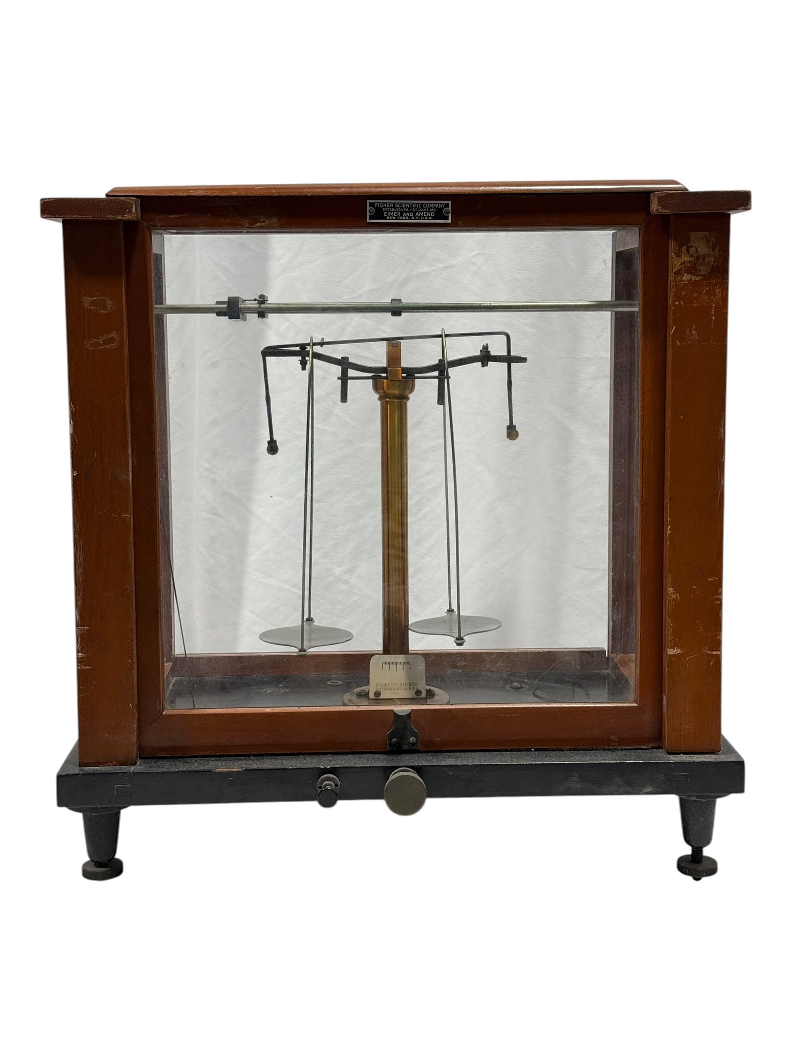 Fisher Scientific / Eimer & Amend Cased Analytical Balance Scale: Vintage laboratory analytical balance housed within a substantial wood and glass enclosure, featuring a precision beam mechanism with suspended metal weighing pans, adjustment controls, and internal