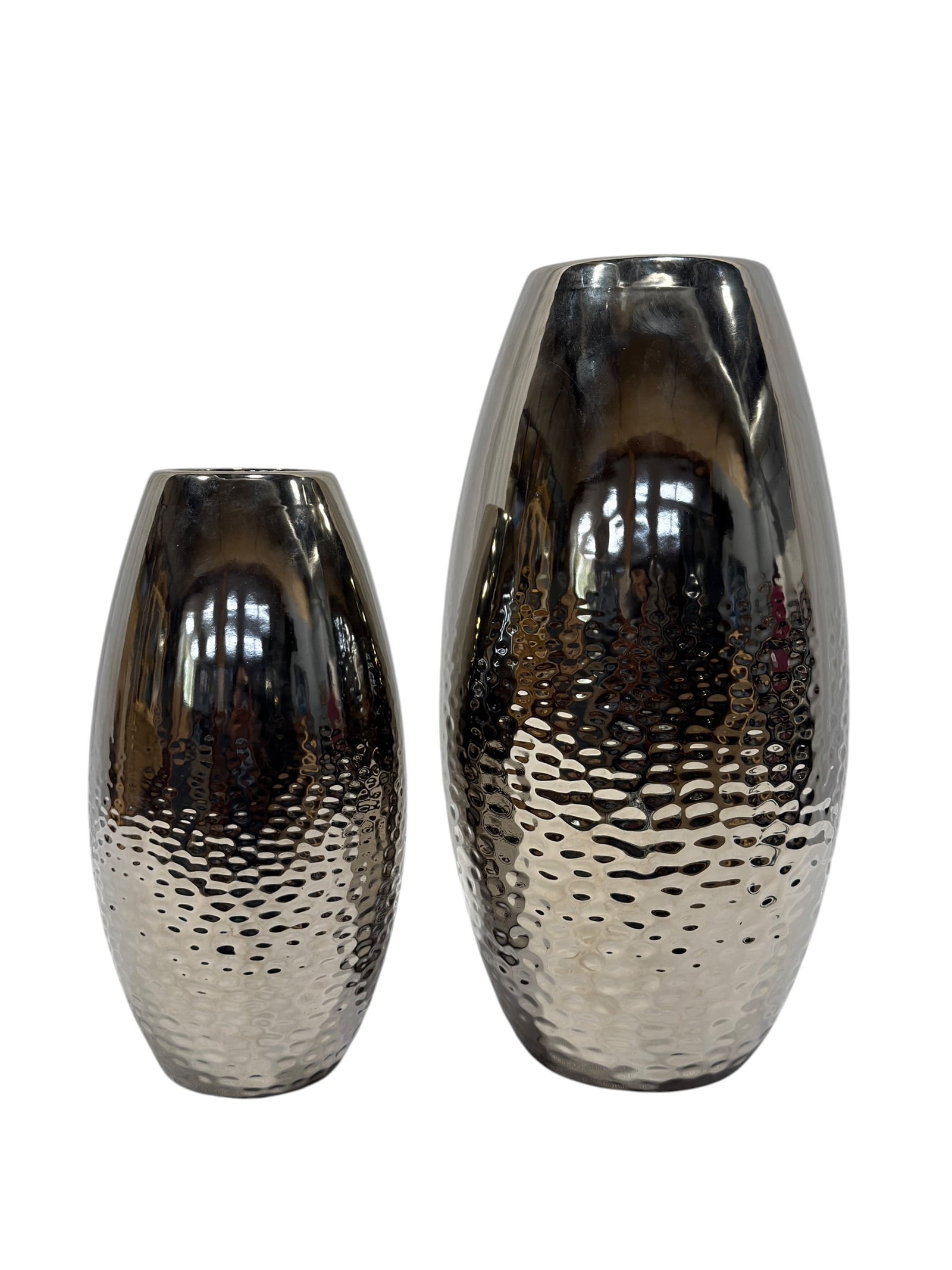 Pair of Contemporary Silvered Ceramic Vases: Striking pair of contemporary ceramic decorative vases featuring elongated ovoid forms with a highly reflective silvered glaze. Each vase transitions from a smooth polished upper body into a textured 