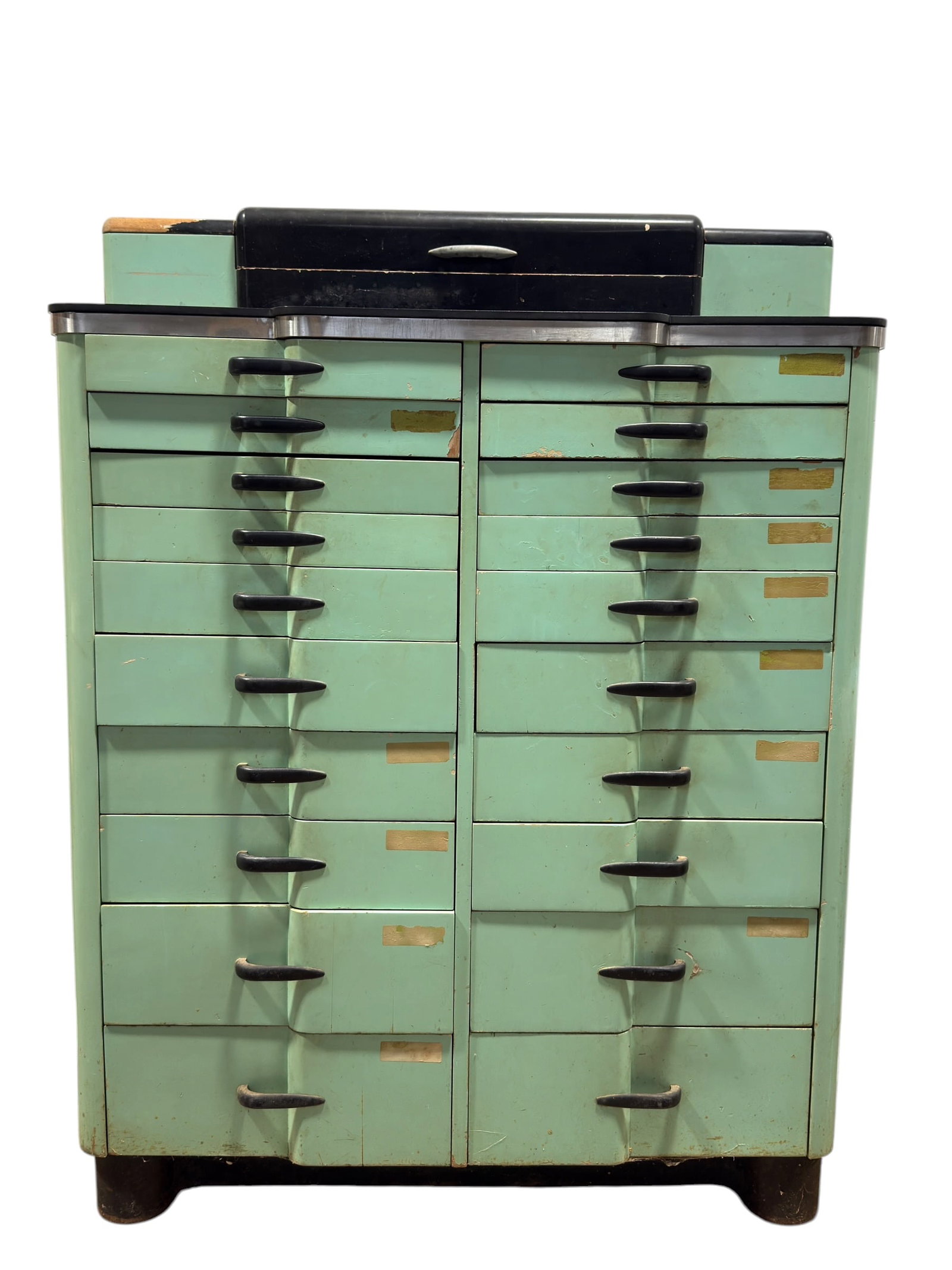 Mid Century Vintage Metal Dental Cabinet w/ Drawers: Striking mid-century dental or medical storage cabinet constructed primarily of painted metal, finished in a distinctive pale mint green with contrasting black trim and streamlined black pulls. The ta