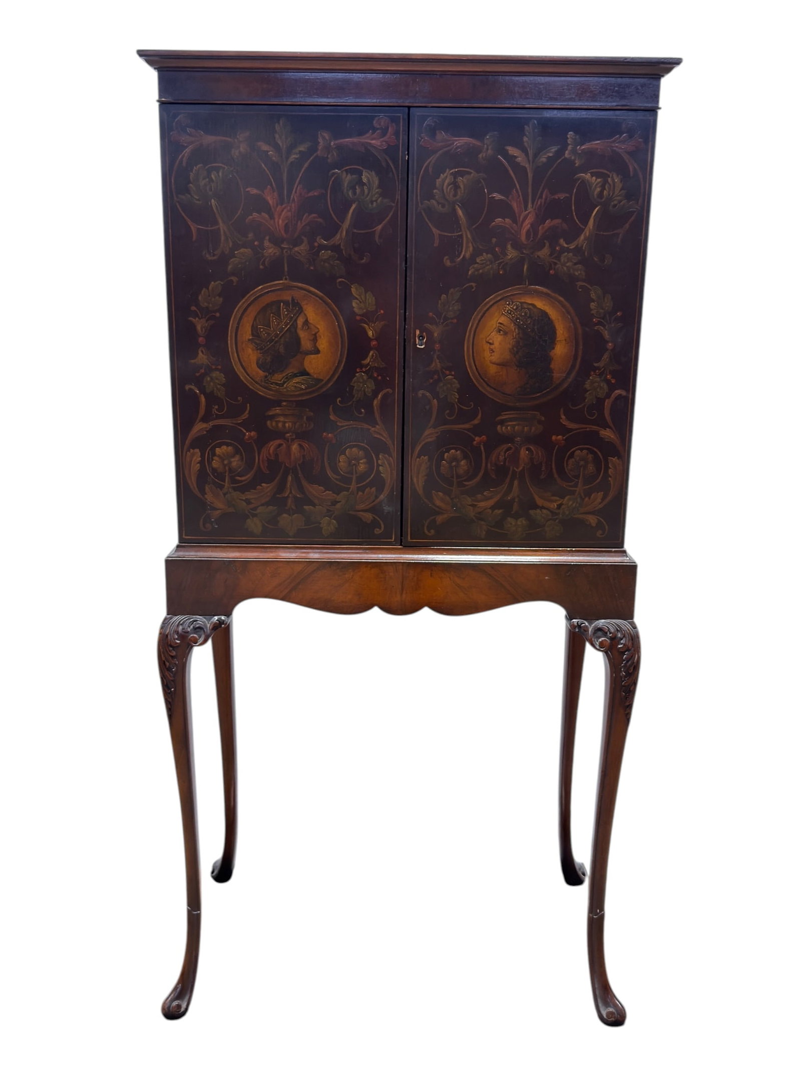 Early 20th C. Hand Painted Queen Anne Style Cabinet: Elegant early 20th century cabinet combining Queen Anne-inspired furniture forms with richly hand-painted decorative panels. The upper case is fitted with two tall doors painted in an elaborate