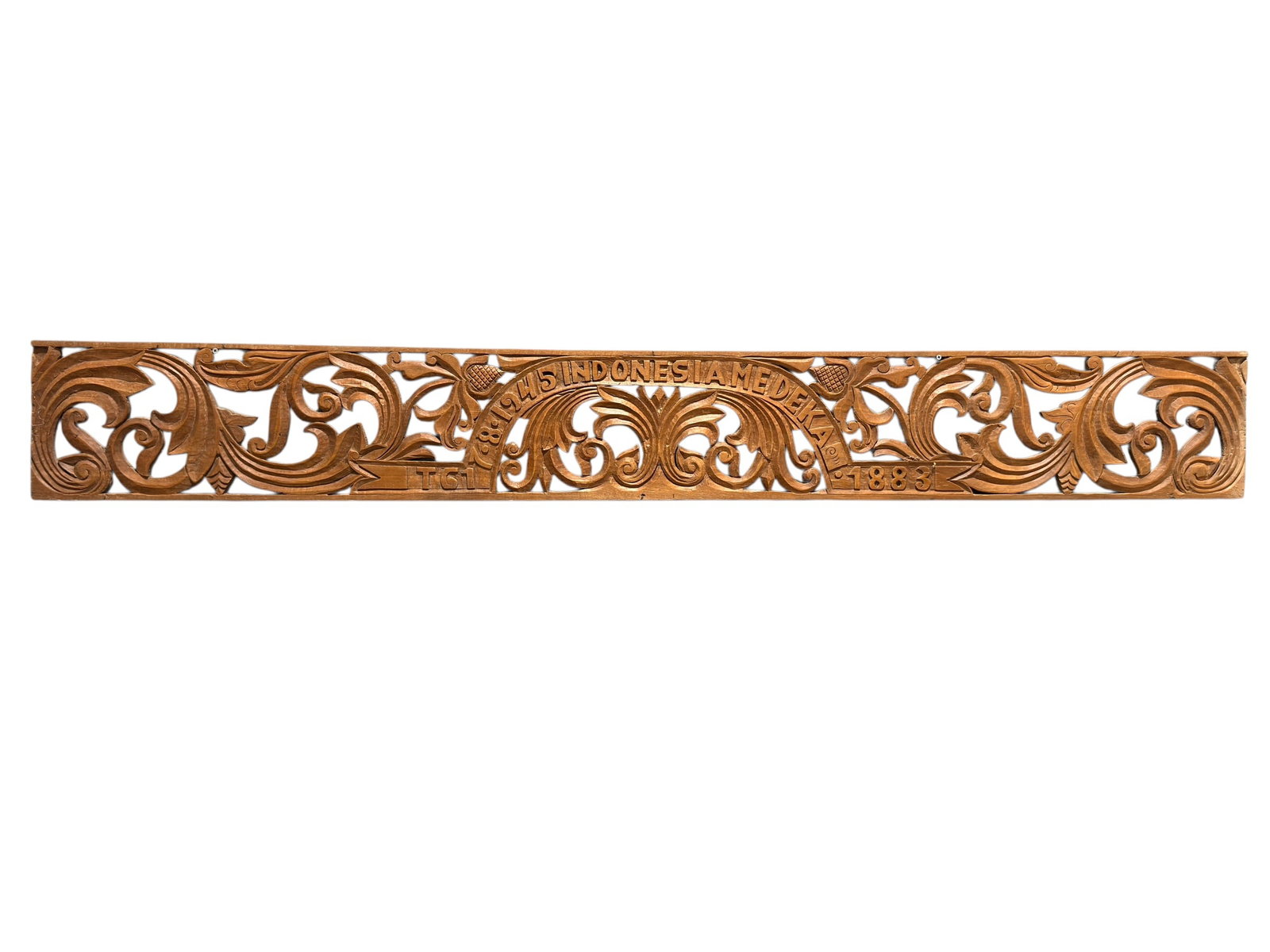 Vintage Indonesian Carved Wood “1945 Indonesia Merdeka?? Wall Panel: Long rectangular carved wood wall panel with elaborate openwork scrolling foliage and stylized floral ornament centered by a commemorative inscription reading “1945 Indonesia Merdeka”,