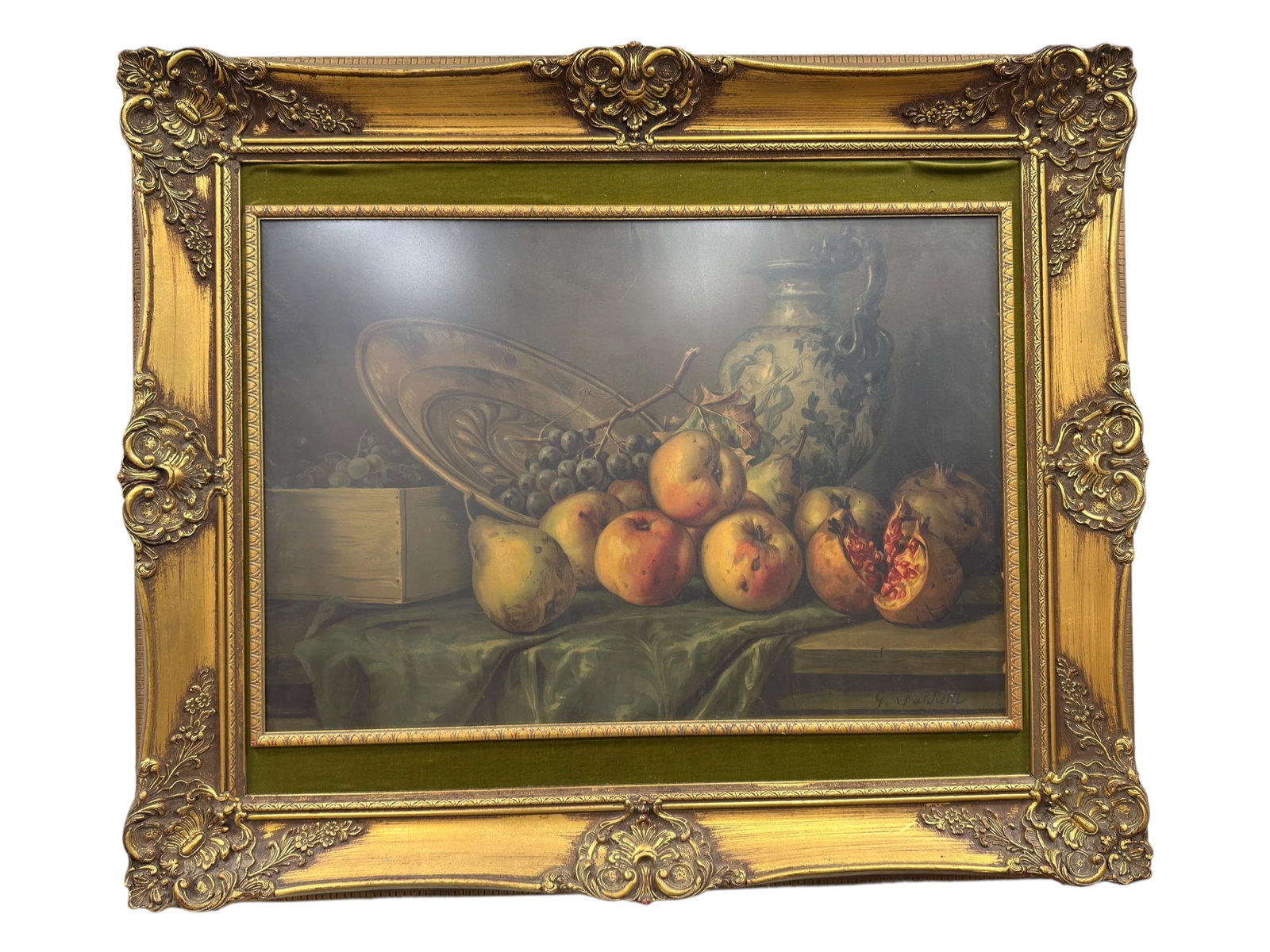 G. Falchetti Pomegranate Still Life Framed Print: Decorative framed print after G. Falchetti depicting a richly arranged still life of pomegranates, grapes, foliage, and draped fabric, rendered in warm muted tones against a dark background. The