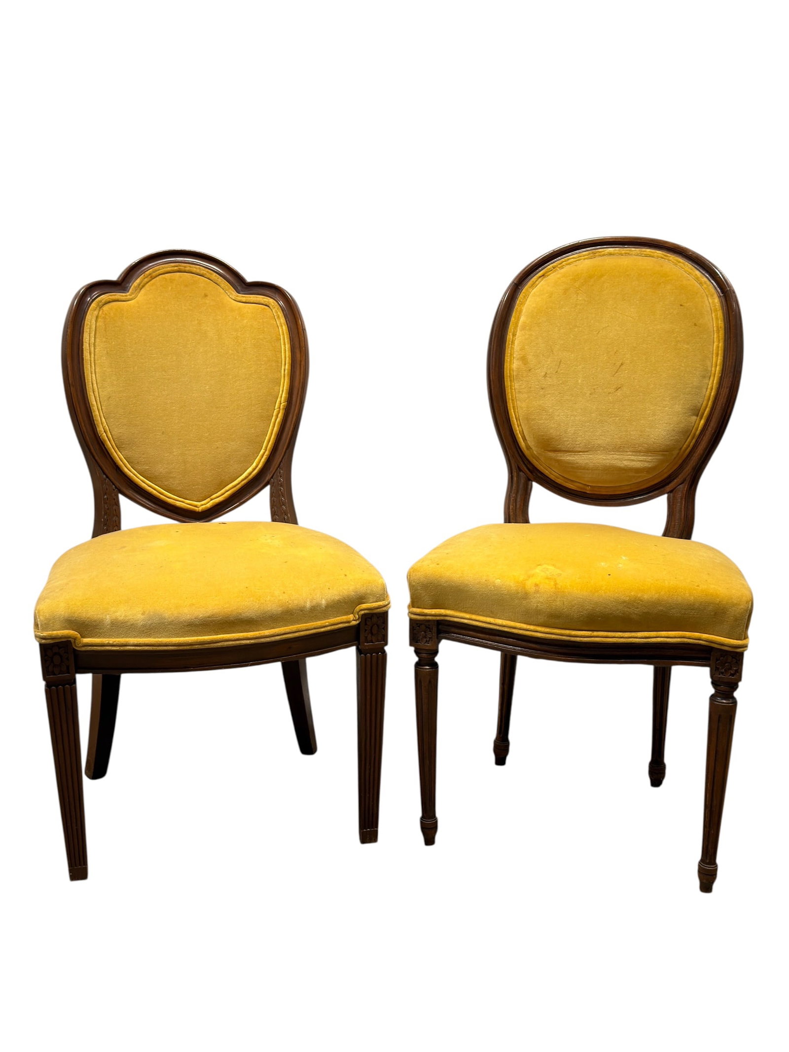 Pair of Louis XVI Style Carved Wood Side Chairs with Mustard Velvet Upholstery: Pair of elegant Louis XVI style side chairs featuring carved hardwood frames with shaped upholstered backs, fluted tapered front legs, and molded seat rails. Each chair is upholstered in mustard-gold