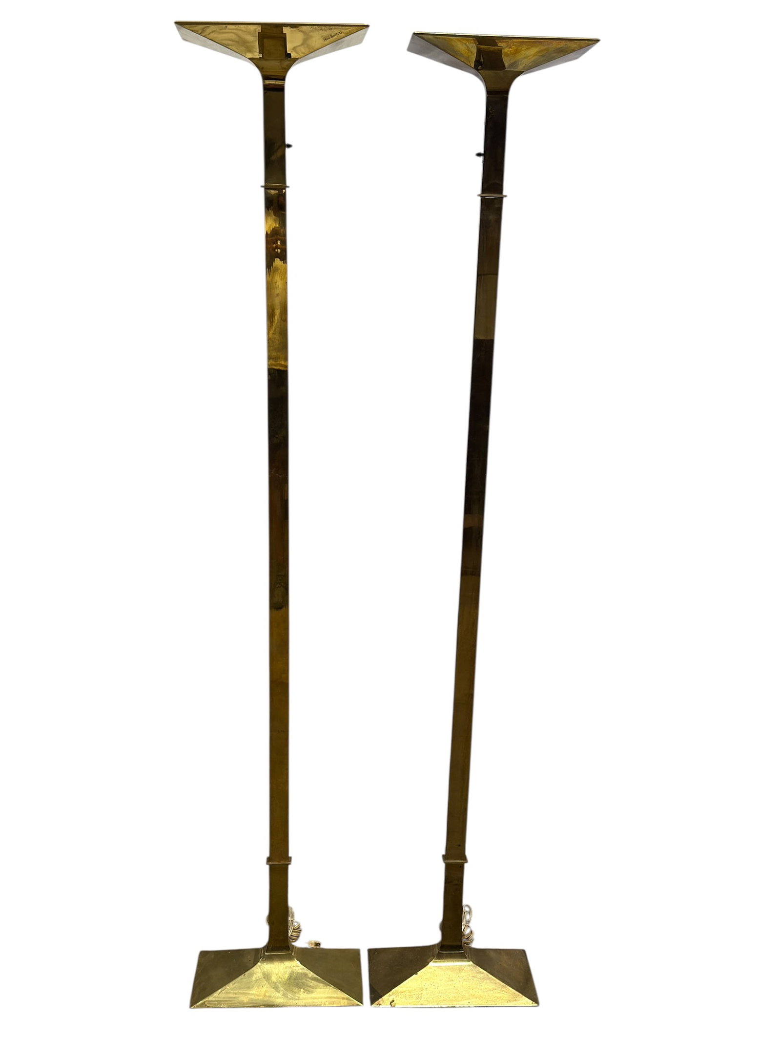 MCM New Society Brass Floor Lamps, Pair: Pair of tall modernist floor lamps by New Society, each executed in polished brass with a strong architectural form featuring a slender rectangular standard, stepped collar details, broad angular pede