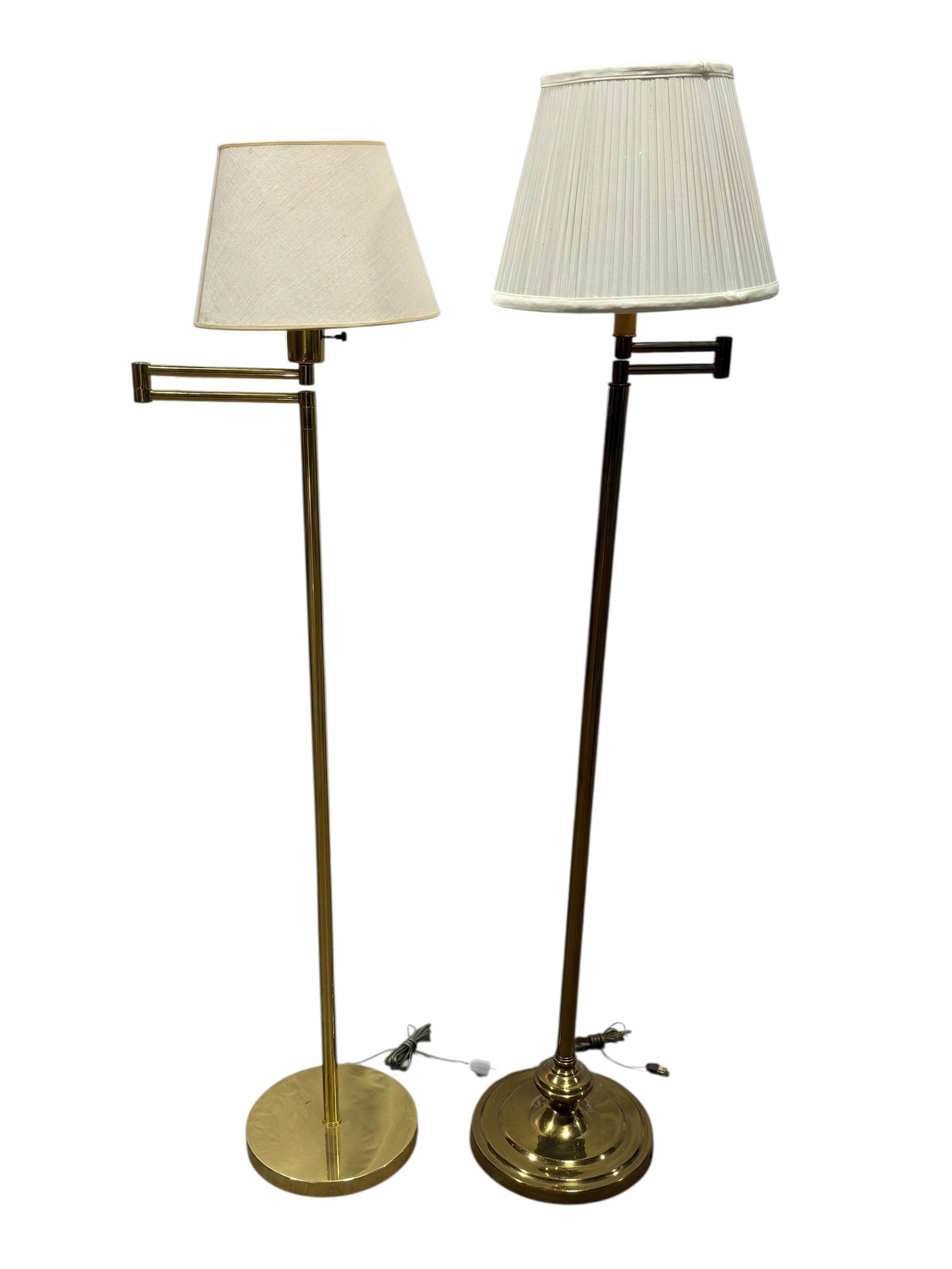 (2) MCM Brass Swing Arm Floor Lamps: Pair of mid-century modern brass floor lamps, each with a tall slender standard, weighted circular base, and articulated double-jointed swing arm allowing the light to be repositioned for reading or a