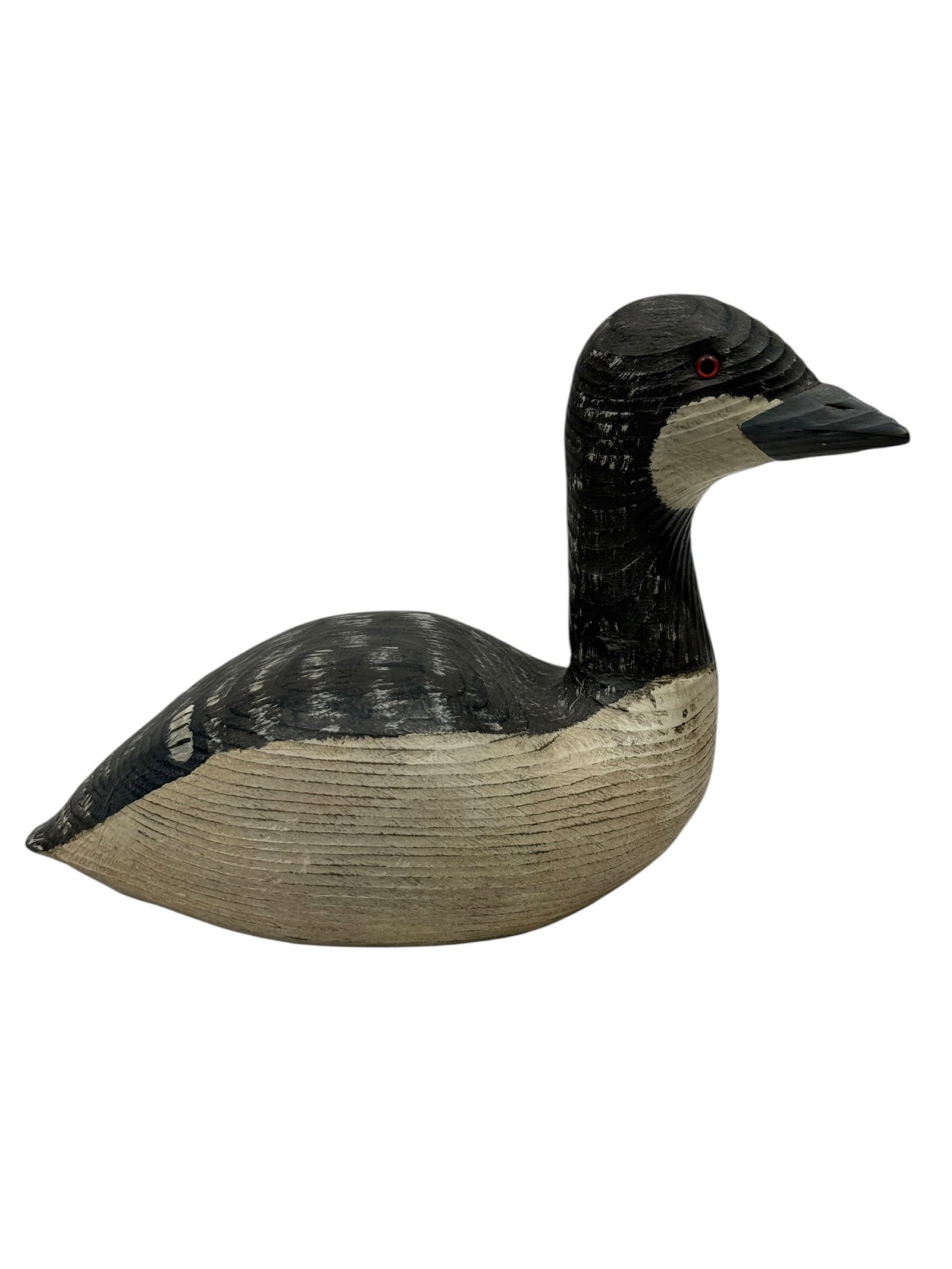 Ray Starns, Hand-Carved & Painted Grebe Decoy, Chincoteague, Virginia: Hand-carved and painted wooden grebe decoy by Ray Starns of Chincoteague, Virginia, modeled with a rounded floating body, upright neck, sharply pointed bill, and inset red glass eyes. The carving feat
