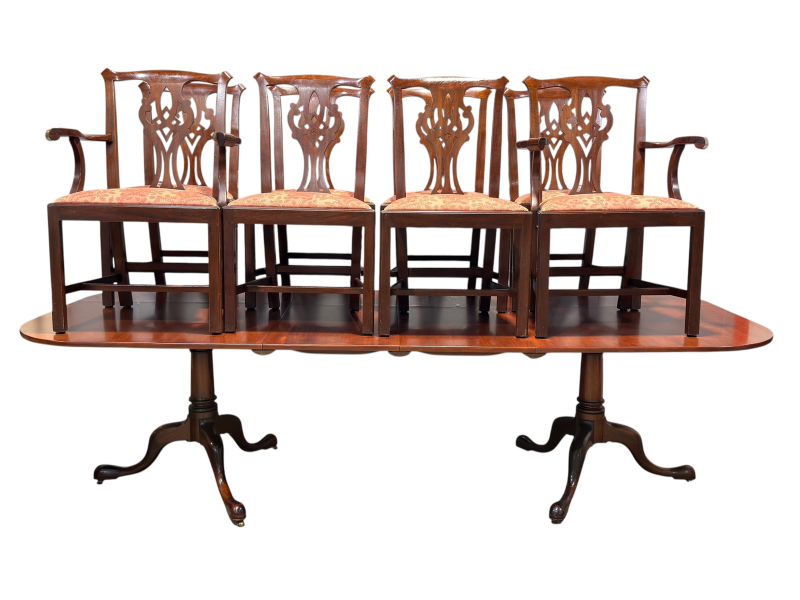 (8) Henkel-Harris Chippendale Dining Chairs w/ Mahogany Dining Table: Formal dining suite consisting of eight Henkel-Harris Chippendale-style dining chairs accompanied by a mahogany double-pedestal dining table. The chairs feature pierced carved splats, molded frames, s