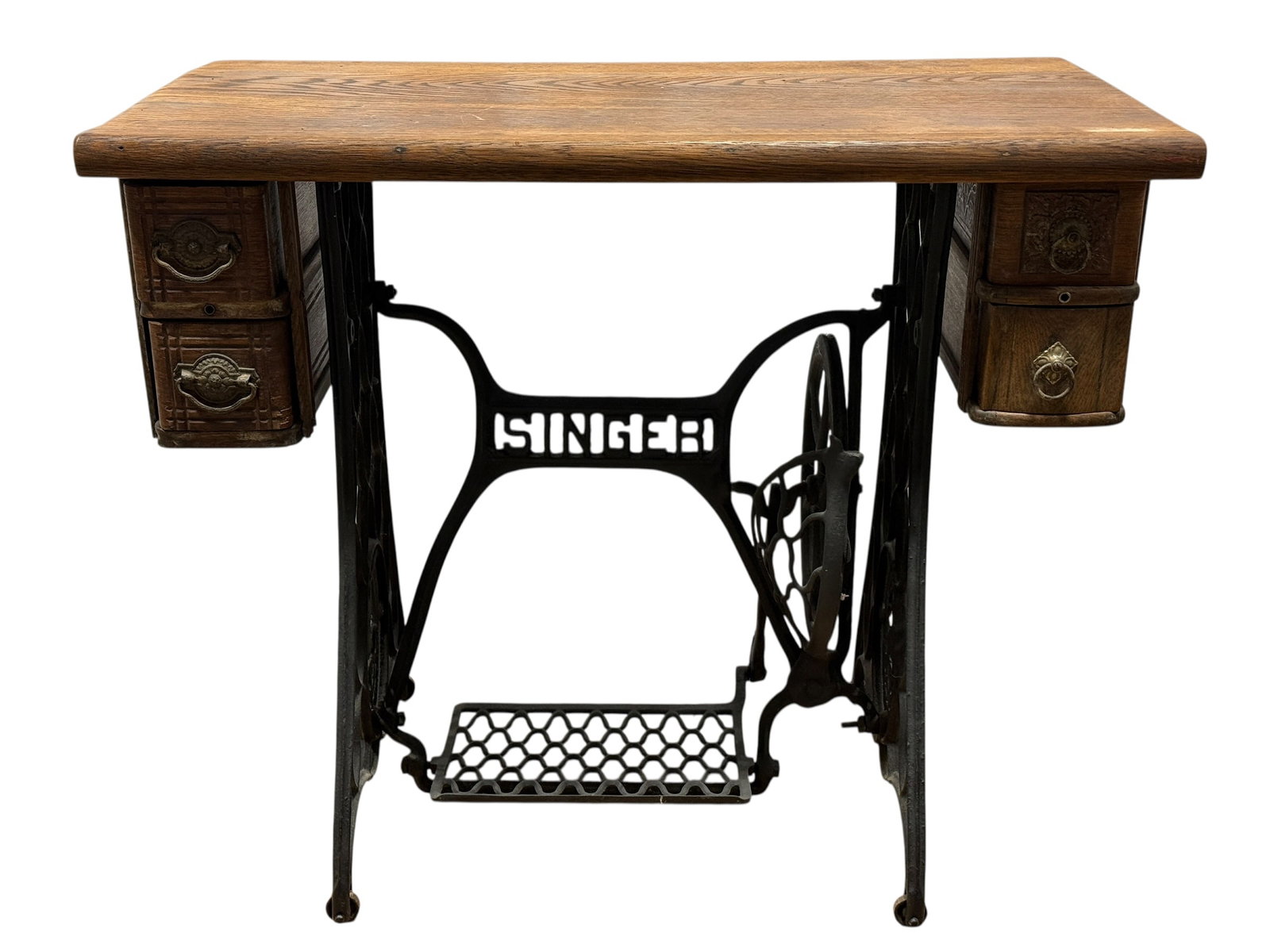 Antique Singer Oak Treadle Sewing Machine Table: Antique Singer treadle sewing table featuring a warm oak cabinet with rounded worktop, four side drawers fitted with decorative ring pulls, and a black cast-iron base prominently cast “SINGER.&rdquo