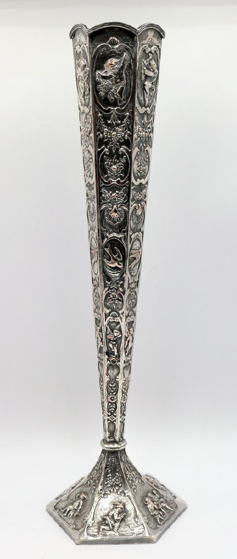 Rare Mark Cross Silver Plated Cherub Vase: Rare Mark Cross Silver Plated Figural Vase. Cherubs, birds, floral and other figures throughout. Measures - 18 5/8" high x 5" wide.