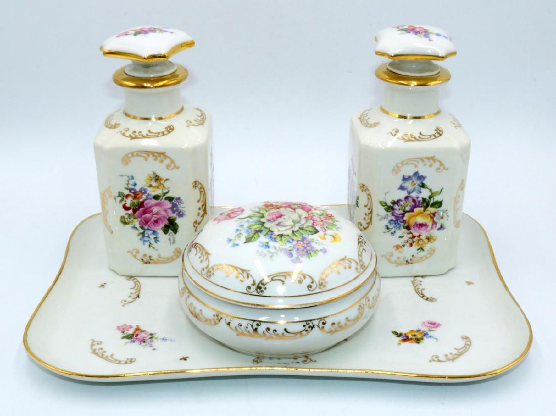 Limoges France Hand Painted Porcelain Dresser Set: Limoges France Hand Painted Porcelain Dresser Set. Two decanters - 6 1/4" High x 2 3/4" wide, powder box - 2 1/2" high x 4 5/8" diameter, tray - 11 1/4" wide x 8" deep.
