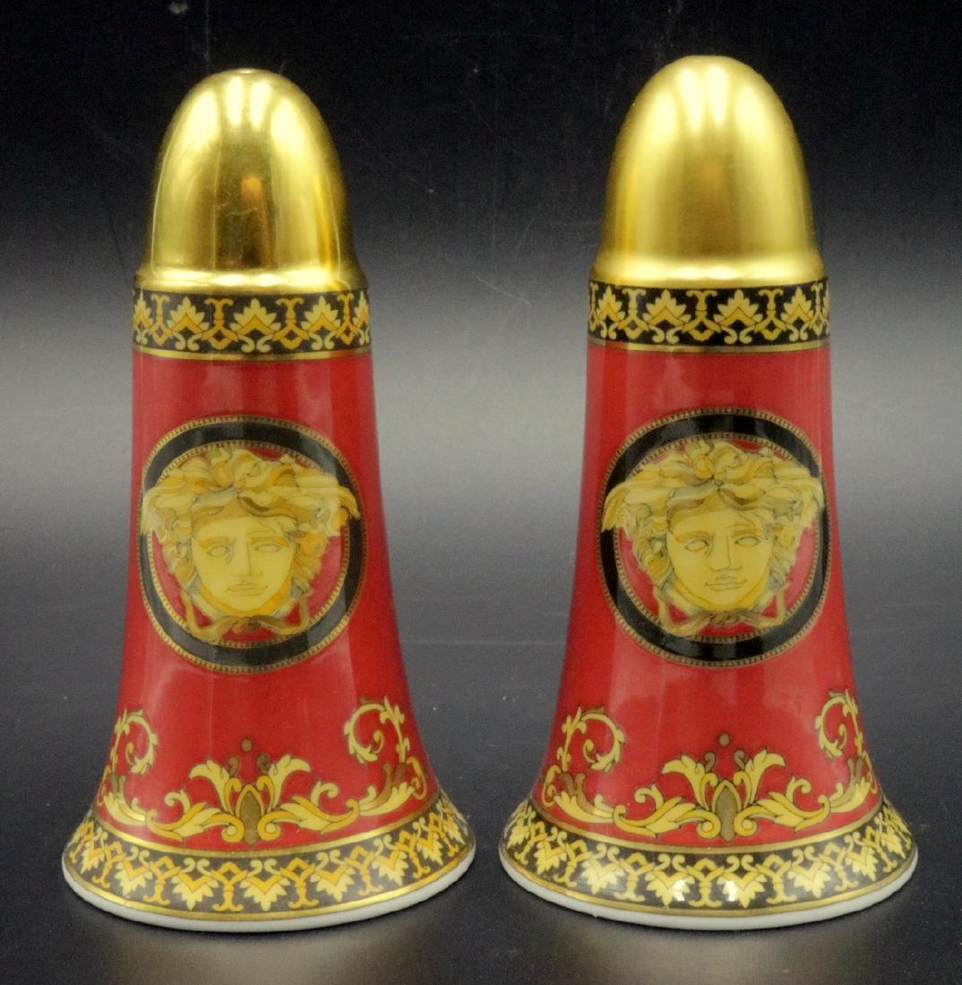 Rosenthal Versace "Medusa" Porcelain Salt & Pepper: Rosenthal Versace "Medusa" Ikarus Red Porcelain Salt & Pepper Shakers. Measures - 4" high x 2 1/8" diameter. Each retail - $165. Gianni Versace, representing luxurious & glamorous design. Versace meet