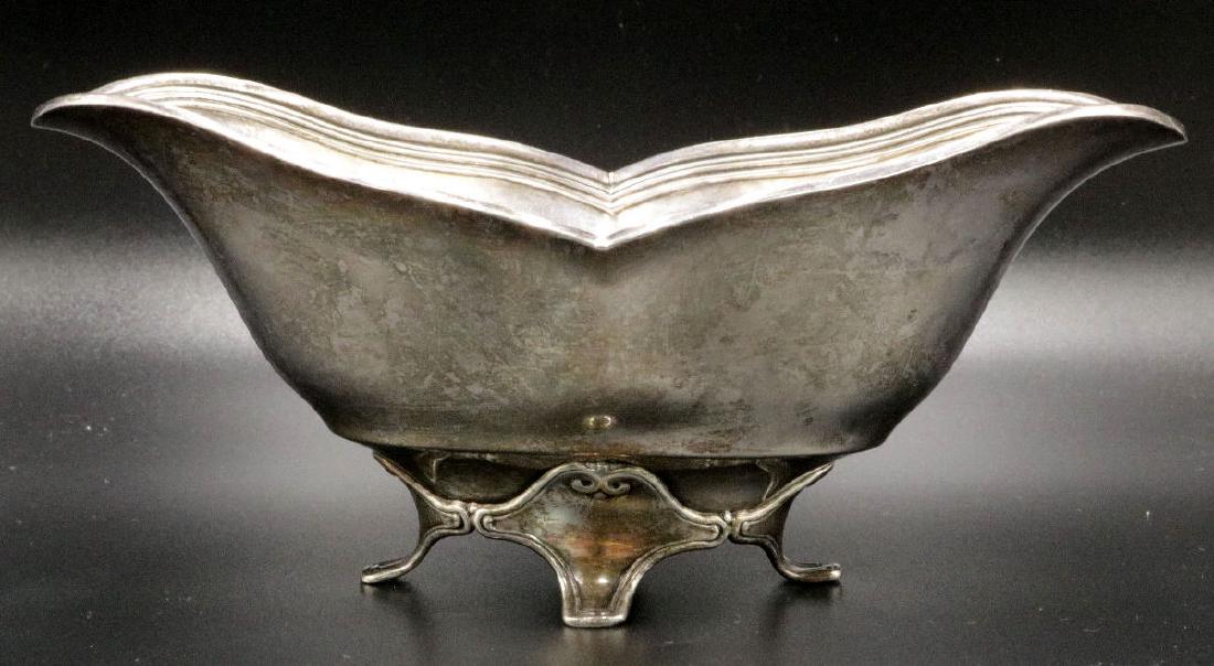 Tiffany & Co. Sterling Footed Bowl: Tiffany & Co. Sterling Silver Footed Bowl. "152602, B1, 5087". Makers mark "M". Monogrammed "8-22-84, Love, Larry, Jon & Rob". Weight - 6.29 troy oz. Measures - 3" high x 7 1/4" long.