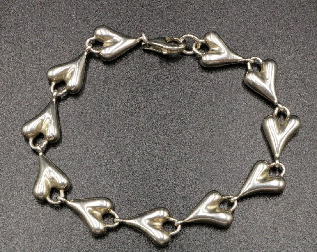 RLM Sterling Modern Link Heart Bracelet: RLM Sterling Silver Modern Link Heart Bracelet. Robert Lee Morris. Weight - 34.7 grams. Measures - 8" long.