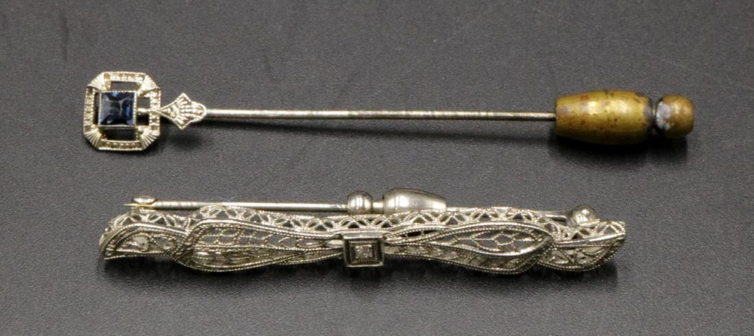 Two Art Deco 10Kt WG Pins: Two Art Deco 10Kt White Gold Pins. Weight - 3.2 dwt. Sapphire stick pin - 2 1/2" long, diamond pin - 2" long.
