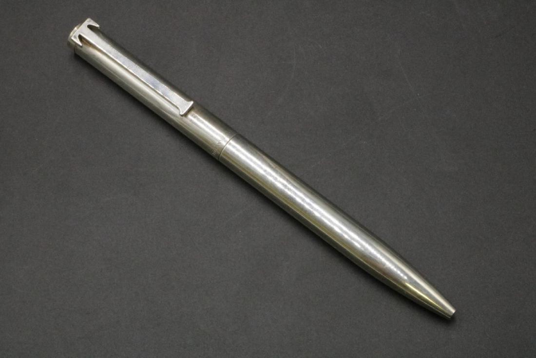 Tiffany & Co. "T" Sterling Silver Pen: Tiffany & Co. "T" Sterling Silver Pen. Measures - 5 3/8" long. Weight - 30.9 grams. With original pouch.