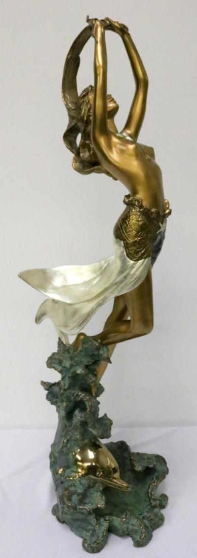 Angelo Basso (Italian 1943-2011) Bronze Sculpture: Angelo Basso (Italian 1943-2011) Bronze Sculpture. Gilt and green painted bronze half-nude rising from sea with dolphin below. Signed in bronze at bottom "A. Basso". Measures - 32 3/4" high x 10" wide