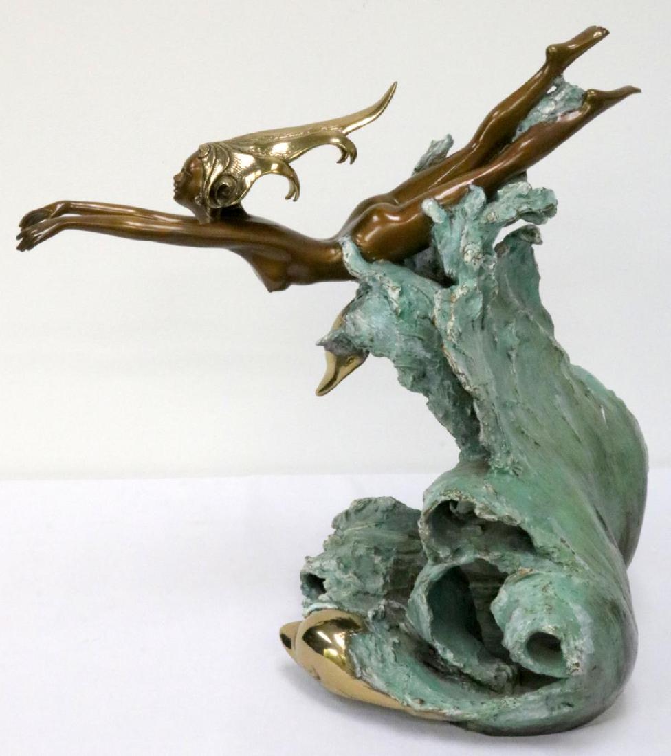 Angelo Basso (Italian 1943-2011) "Companions" Bronze: Angelo Basso (Italian 1943-2011) "Companions" Bronze Sculpture. Measures - 16 1/2" high x 16 1/2" wide. Depicting female nude with dolphins in wave.