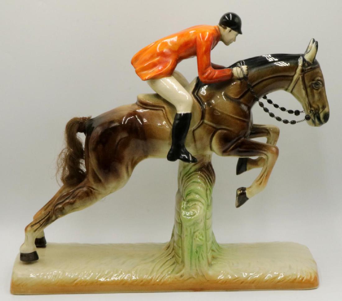 Hubert Bequet Belgian Majolica Steeplechase Figure: Early 20th century hand-painted Majolica porcelain steeplechase figurine by Hubert Bequet, Belgium. Signed to bottom "Piece d'Art, H. Bequet" and stamped with green factory mark. Measures approx. 13-1