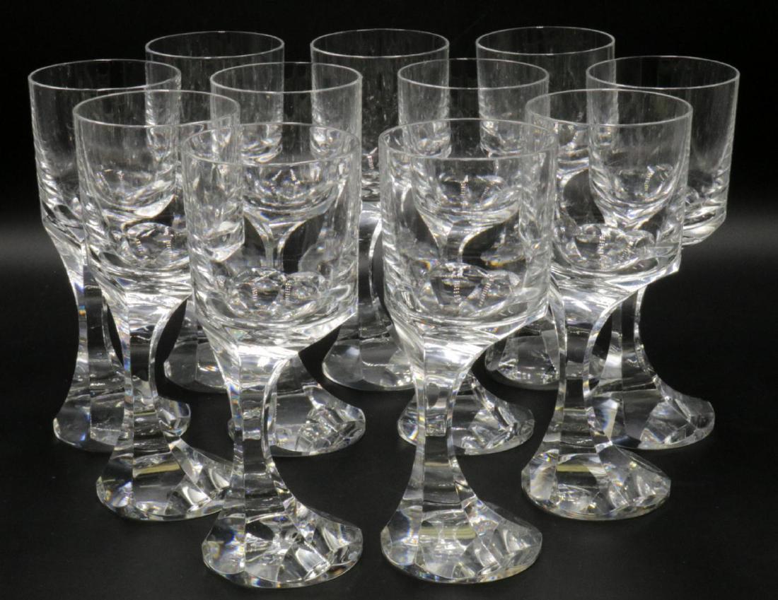 11 Pc . Baccarat "Narcisse" Crystal Wine Glasses: 11 Pc . Baccarat France "Narcisse" Circa 2004 Crystal Wine Stemware. Measures - 6 3/4" high x 2 3/4" diameter. Unique off center design, all in excellent condition. Baccarat France stamp on bottom.