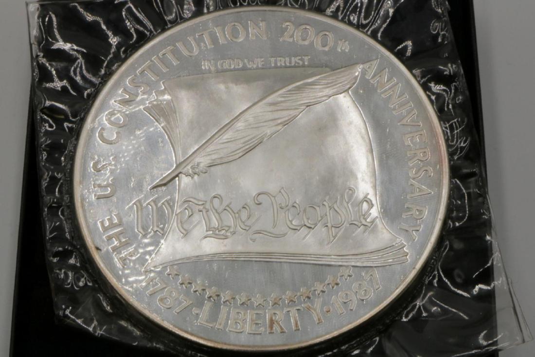 1 Pound .999 Sterling Silver Coin: U.S. Constitution 200th Anniversary Sterling Silver Coin. Unopened one pound of silver. Measures - 3 1/2" diameter. With original fitted box.