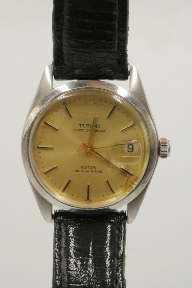 Rolex, Tudor Prince Oyster Date Automatic Watch: Rolex, Tudor Prince Oyster Date Automatic Watch. "Original Oyster Case By Rolex Geneve" on back. With black leather band. 8 3/4" long. Please note: the Tudor symbol is not in place, it is in the botto